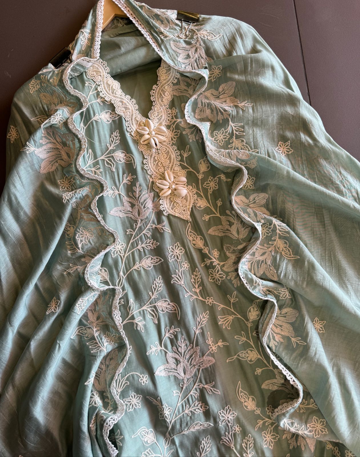 Soft linen cotton shirt (Unstitched)with crochia lace neck detailings with original shankh attached on the neckline