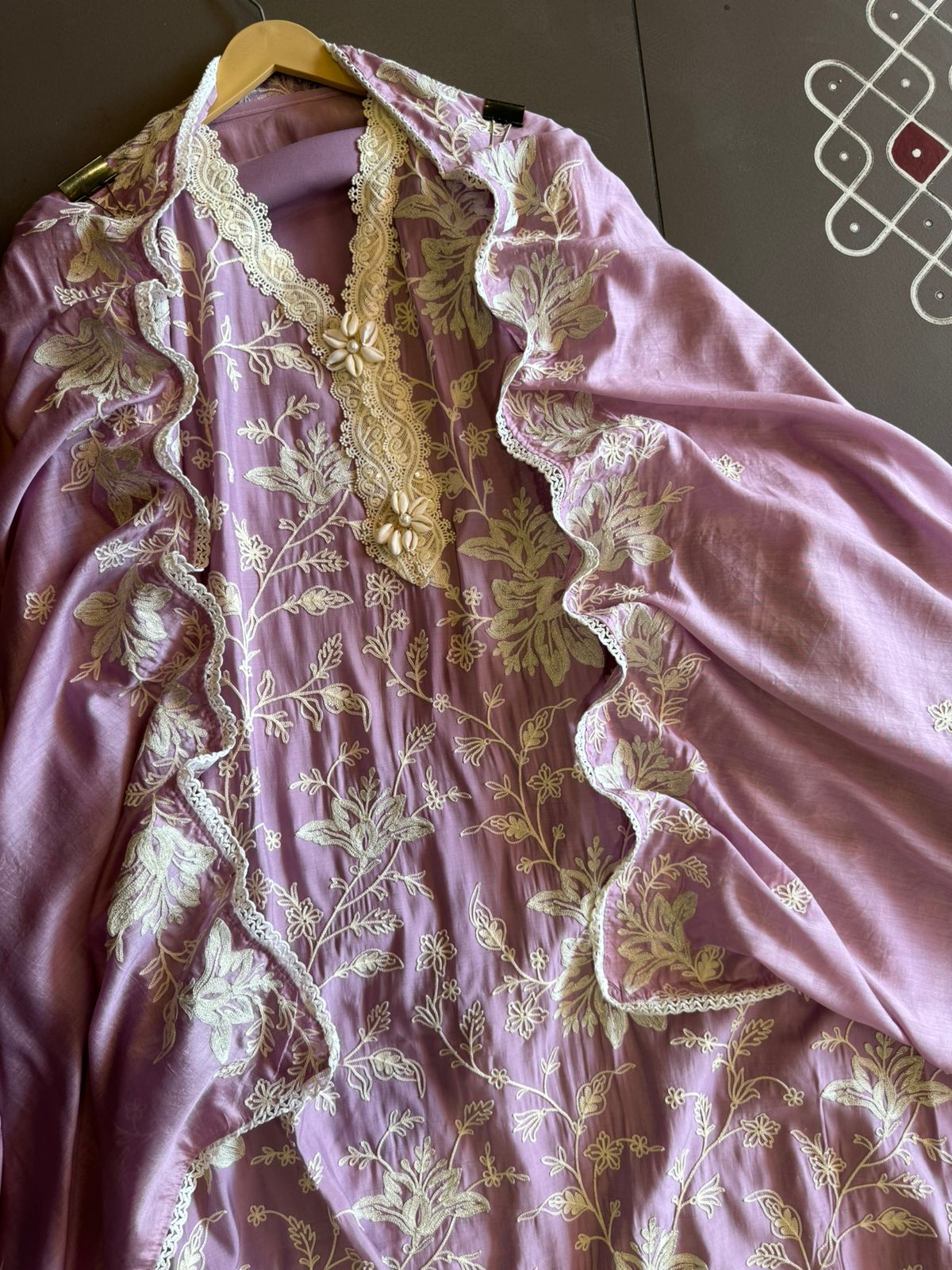 Soft linen cotton shirt (Unstitched)with crochia lace neck detailings with original shankh attached on the neckline