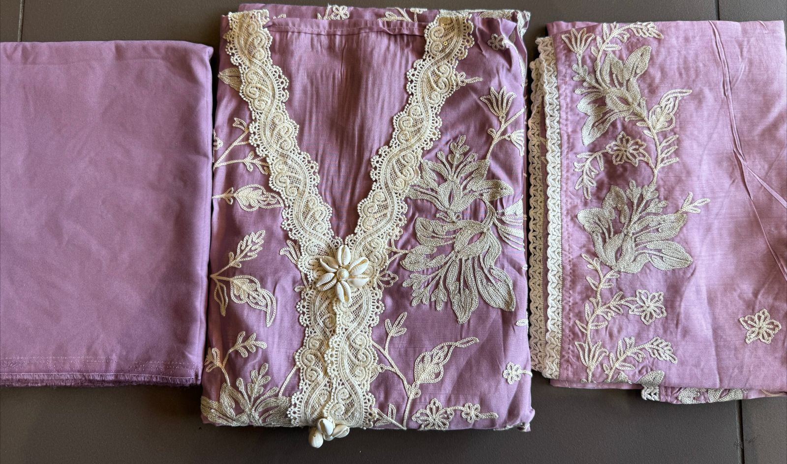 Soft linen cotton shirt (Unstitched)with crochia lace neck detailings with original shankh attached on the neckline