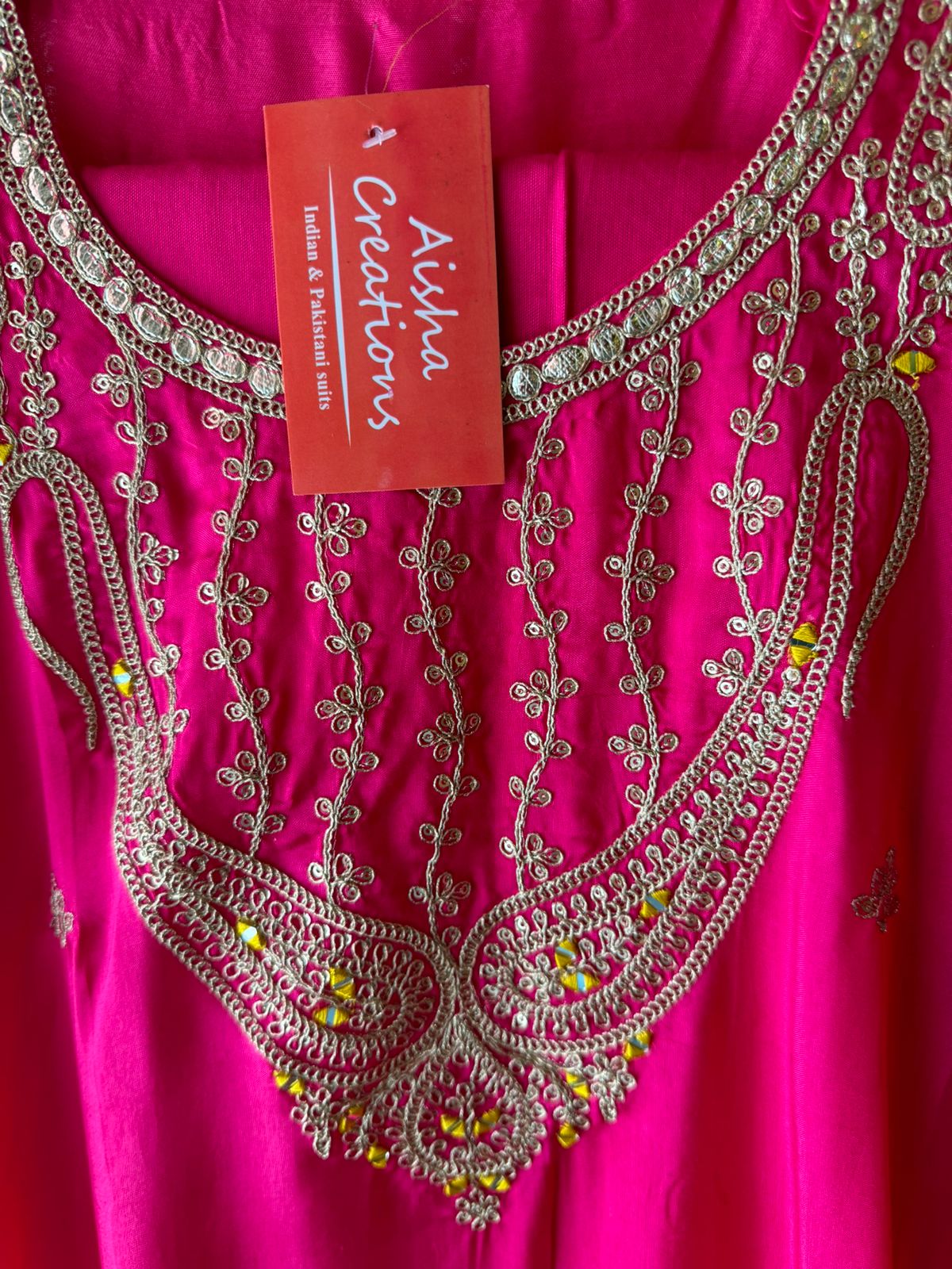 Pure silk unstitched shirt with beautiful designer embroidery on neckline and bootas all over the shirt