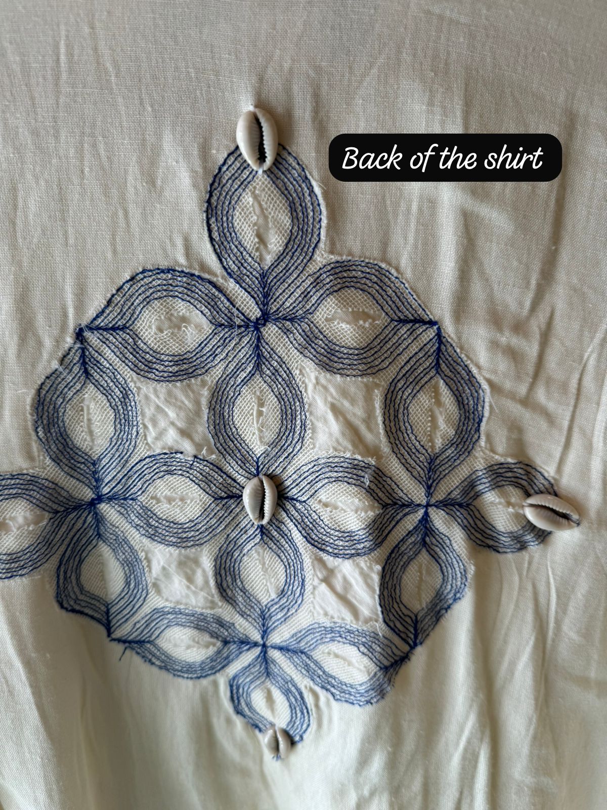 It has cotton Cutwork applique work on the shoulder and sleeves and back with shankh Beads attached