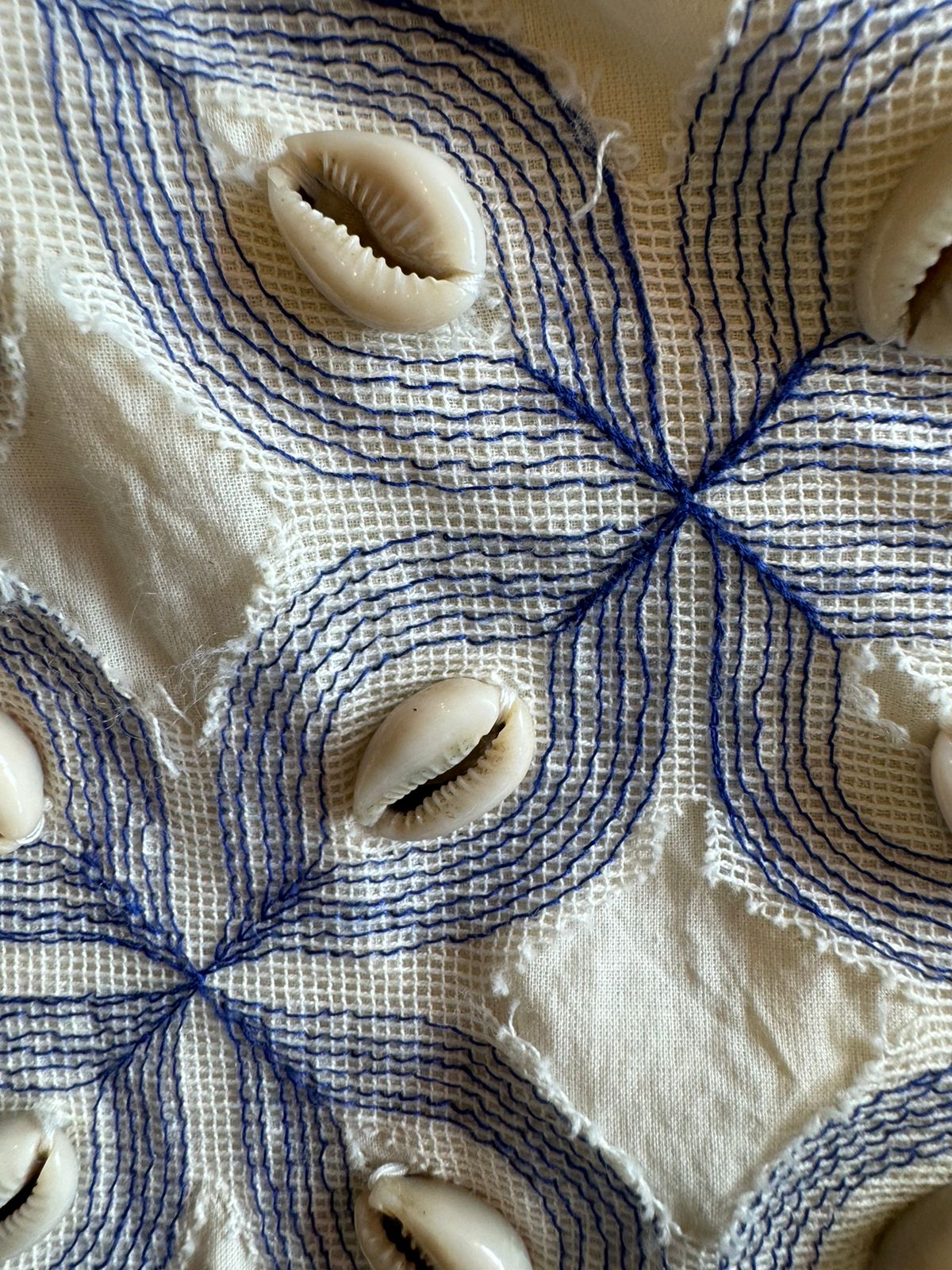 It has cotton Cutwork applique work on the shoulder and sleeves and back with shankh Beads attached