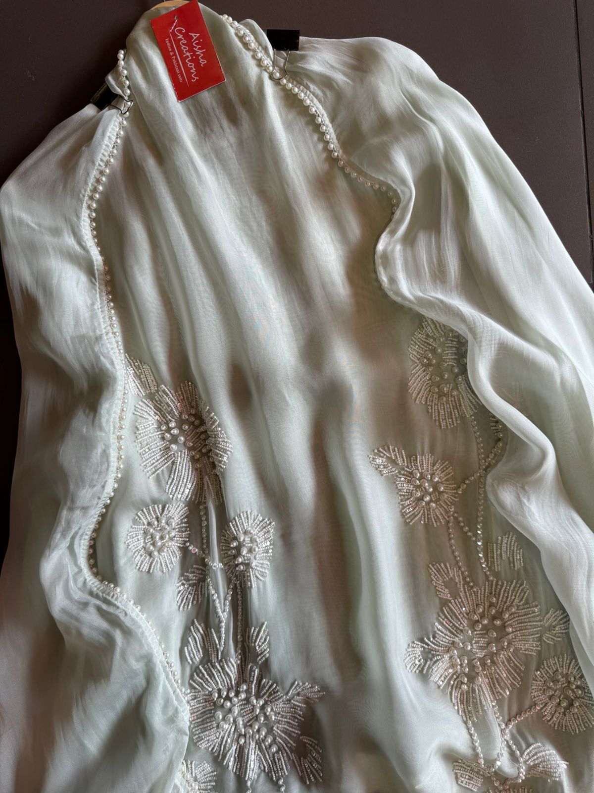 Shop our new exclusive range of Pakistani fabrics on soft organza with original pearl and Moti work