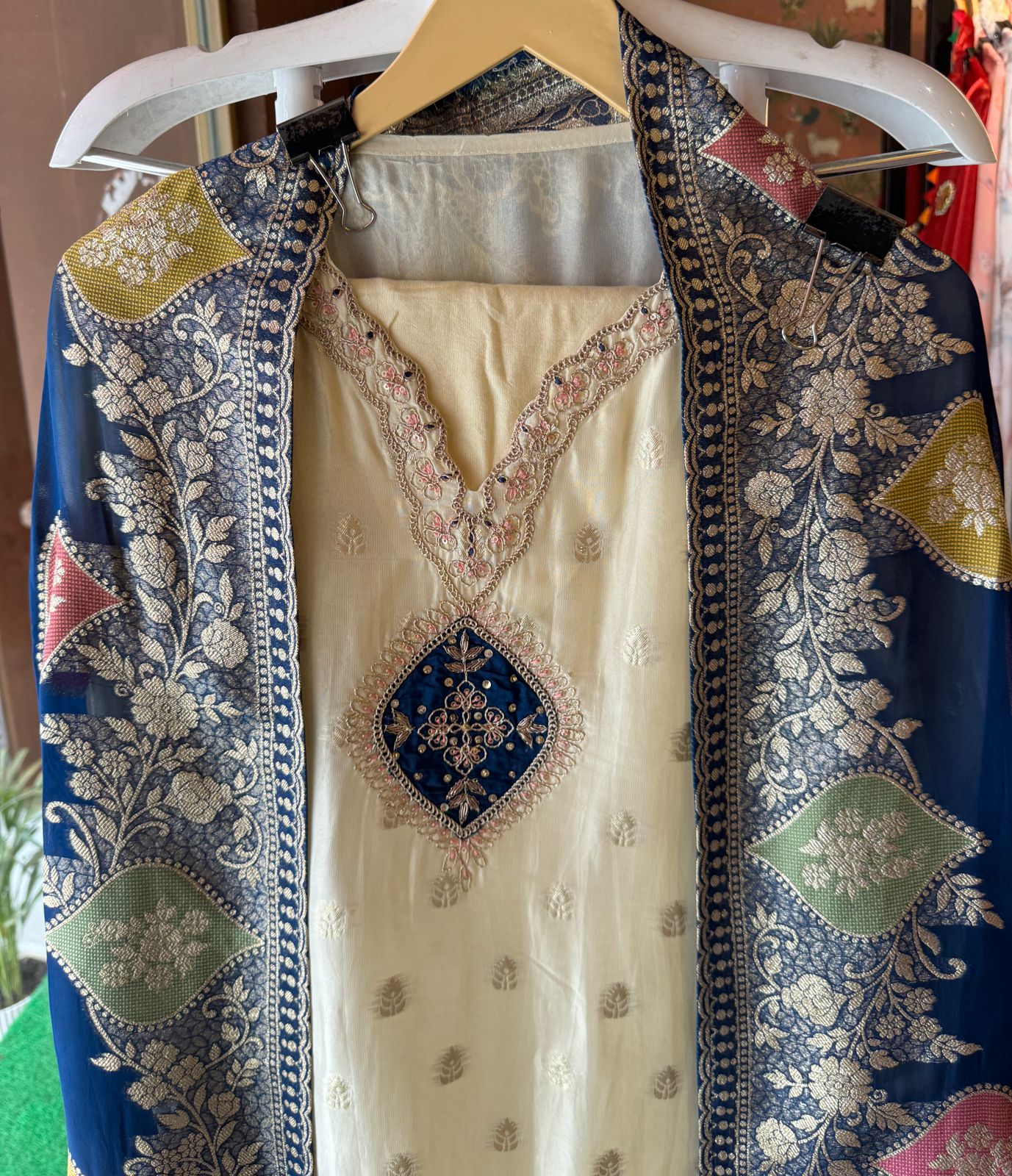 Soft organza Unstitched shirt with gold zari booties highlighting on the shirt front