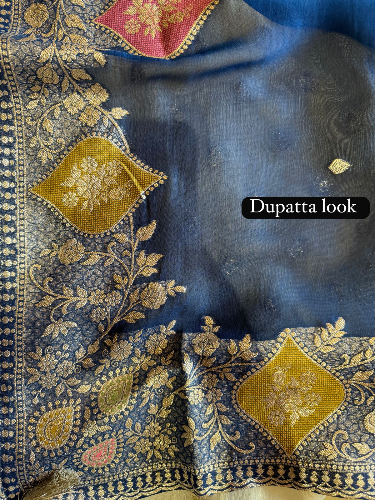 Soft organza Unstitched shirt with gold zari booties highlighting on the shirt front