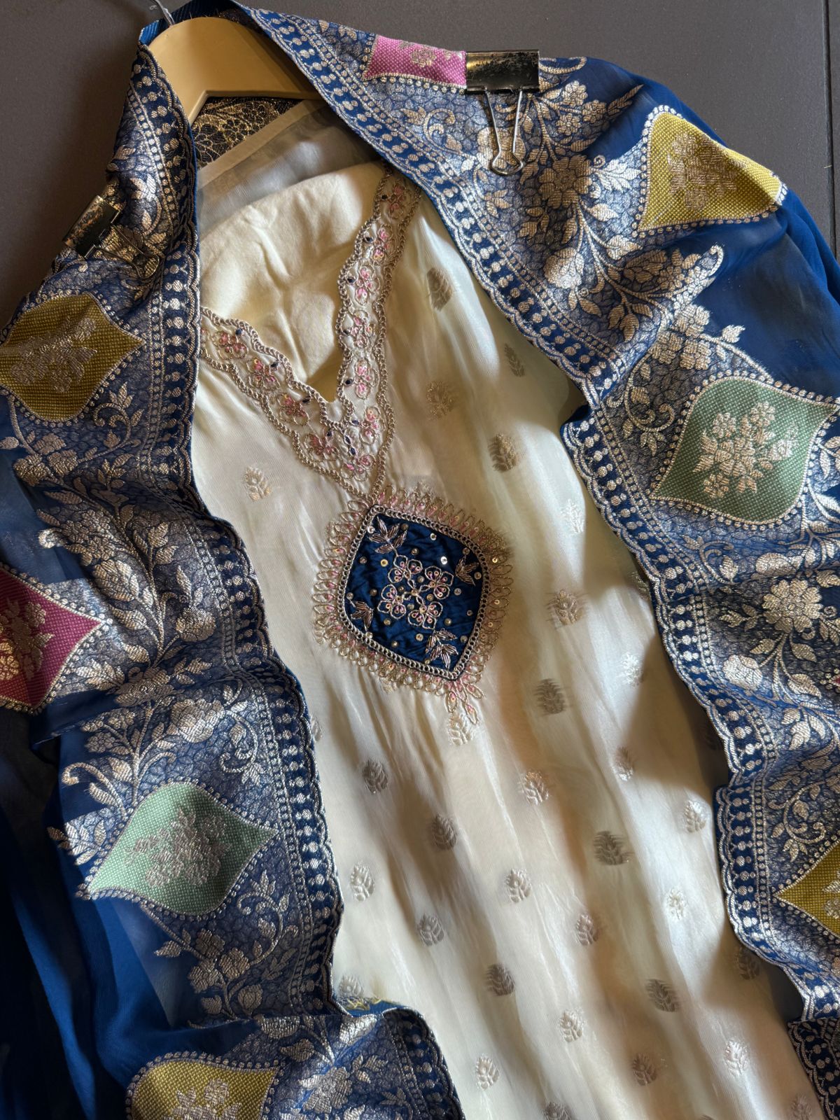 Soft organza Unstitched shirt with gold zari booties highlighting on the shirt front