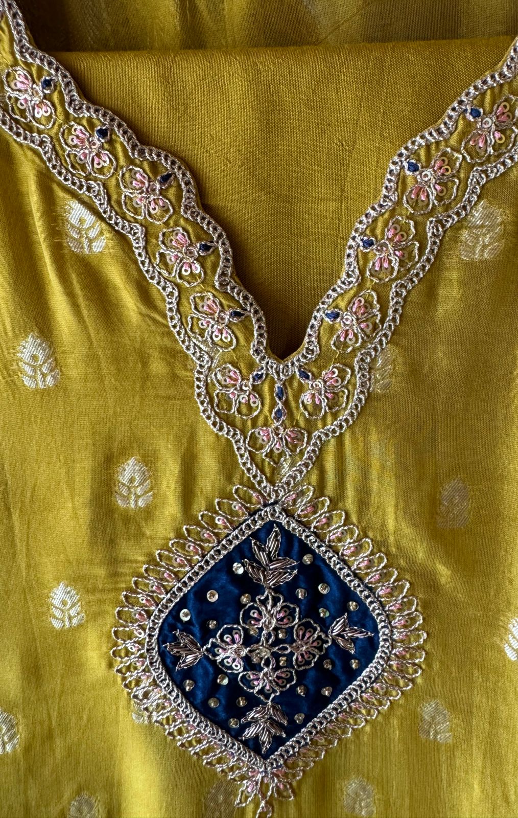 Soft organza Unstitched shirt with gold zari booties highlighting on the shirt front