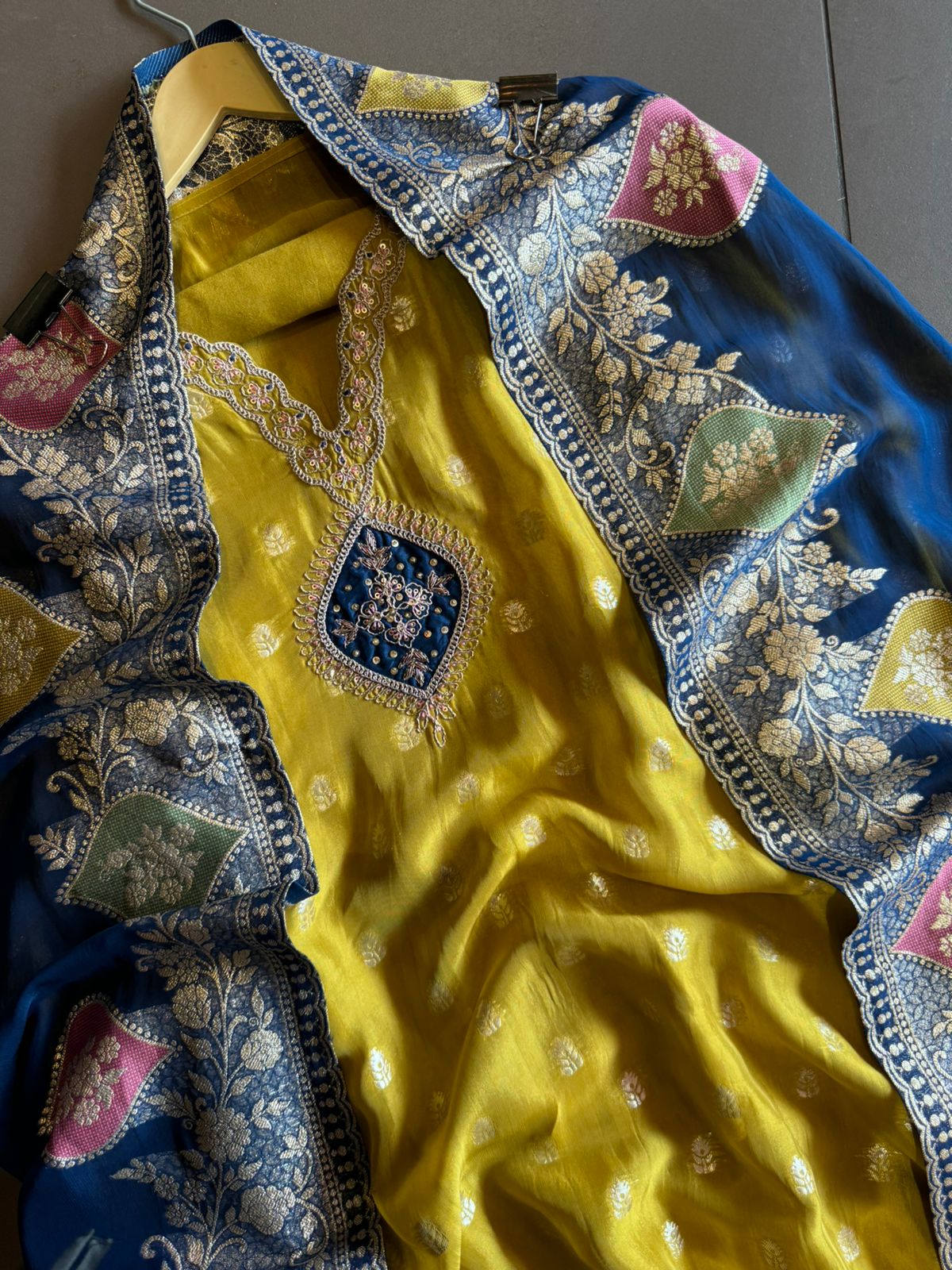 Soft organza Unstitched shirt with gold zari booties highlighting on the shirt front