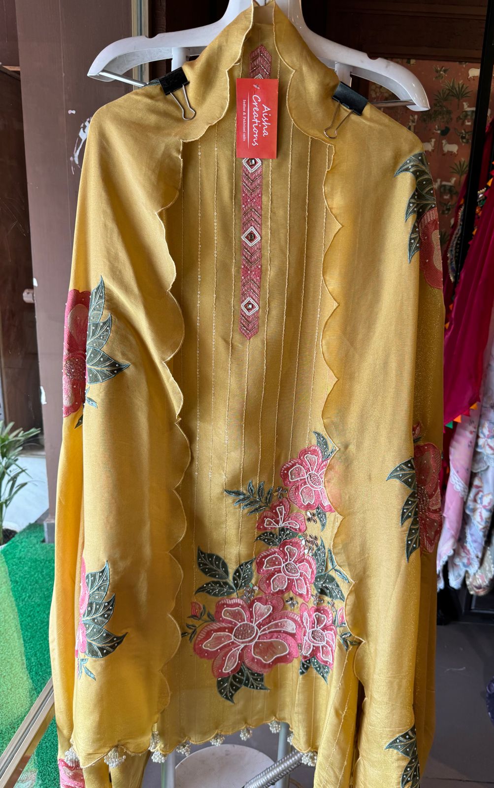 The shirt front has very beautiful floral embroidered boota with pearl work detailings