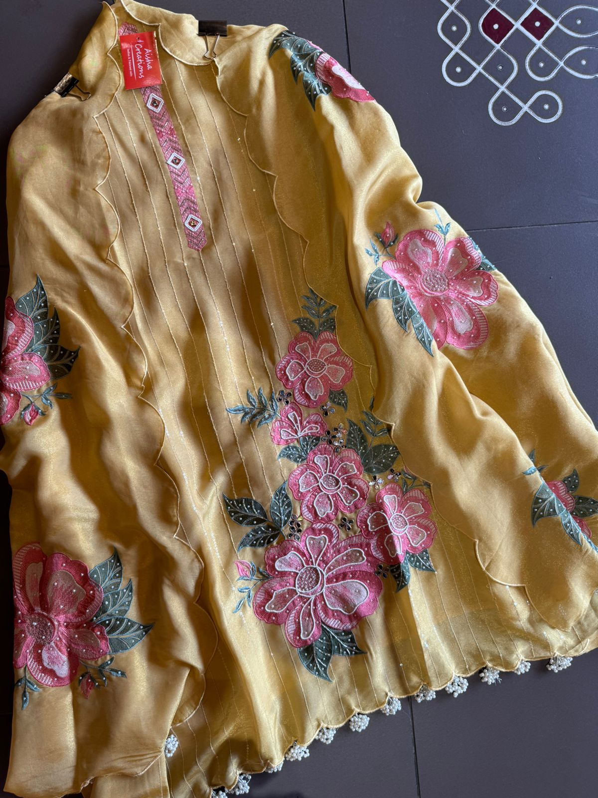 The shirt front has very beautiful floral embroidered boota with pearl work detailings