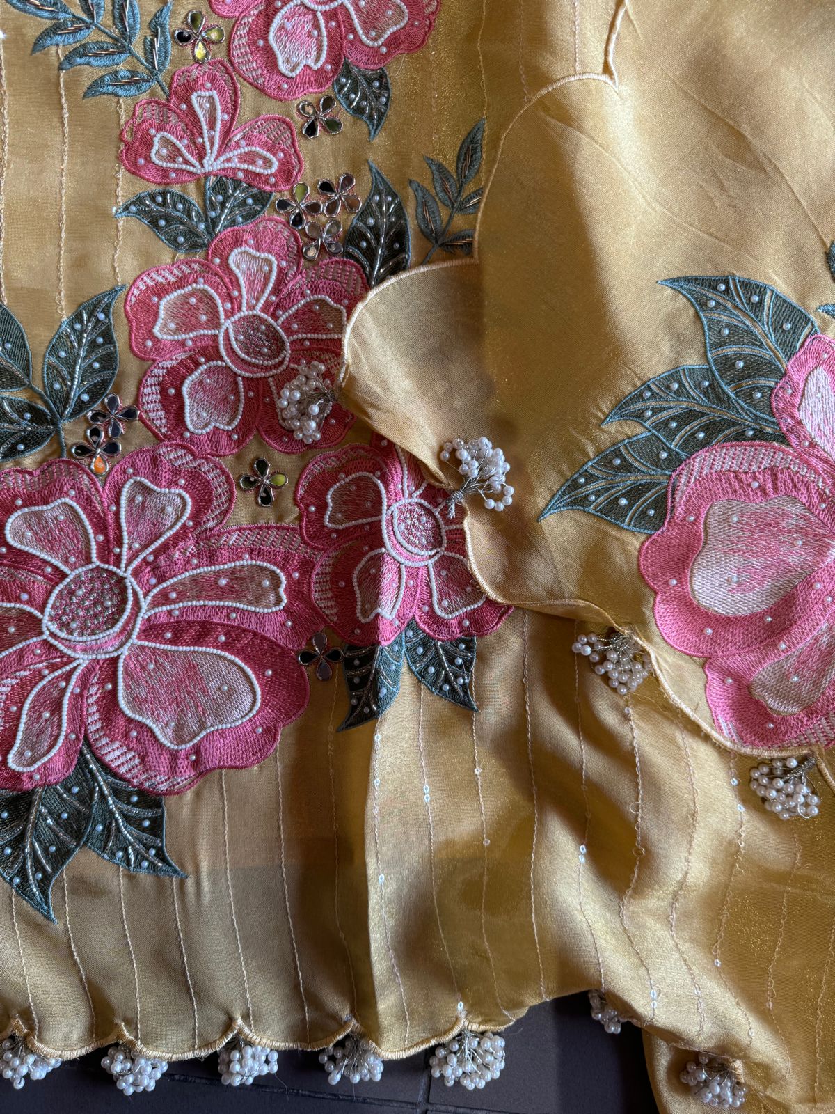 The shirt front has very beautiful floral embroidered boota with pearl work detailings