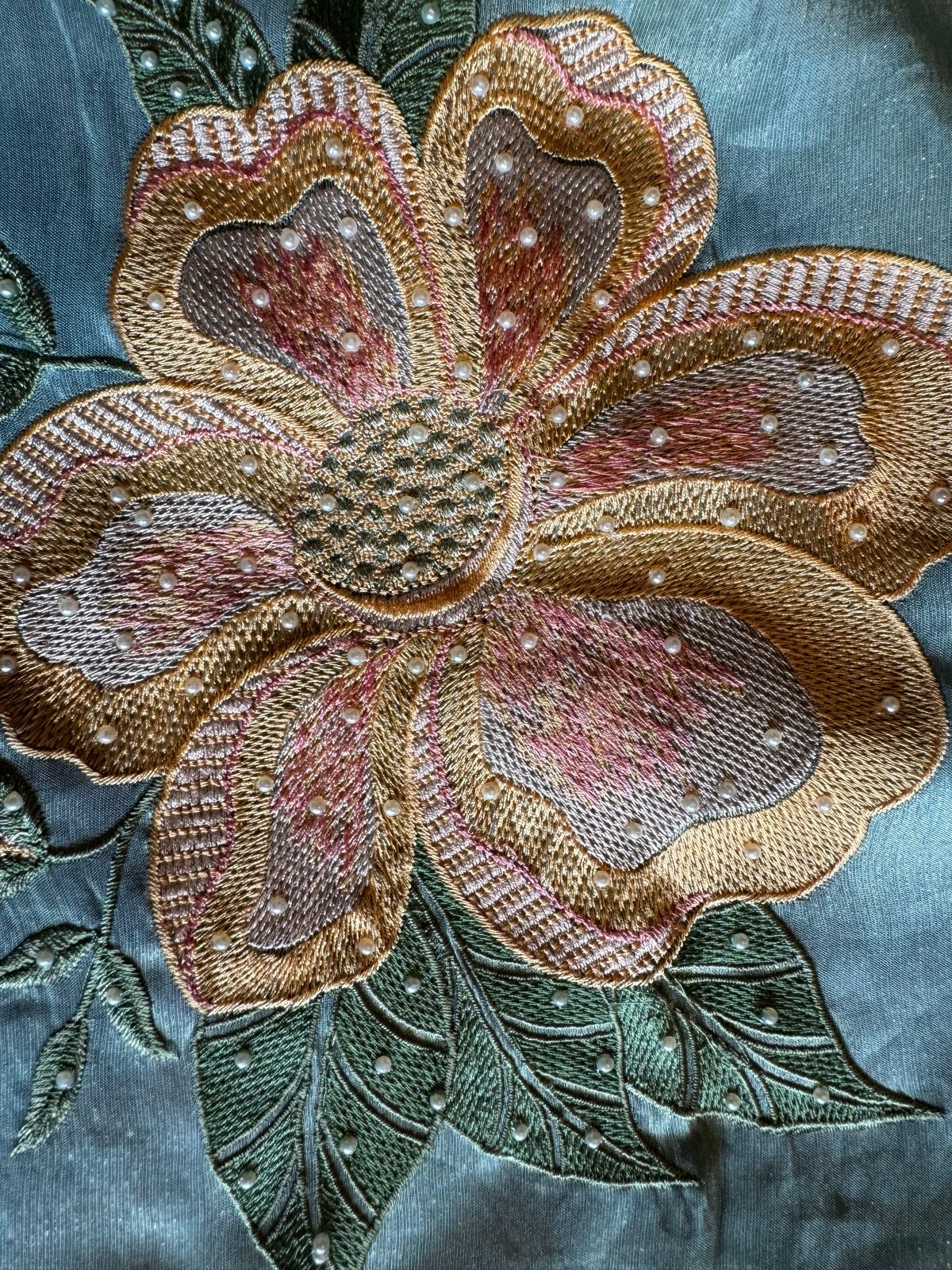 The shirt front has very beautiful floral embroidered boota with pearl work detailings