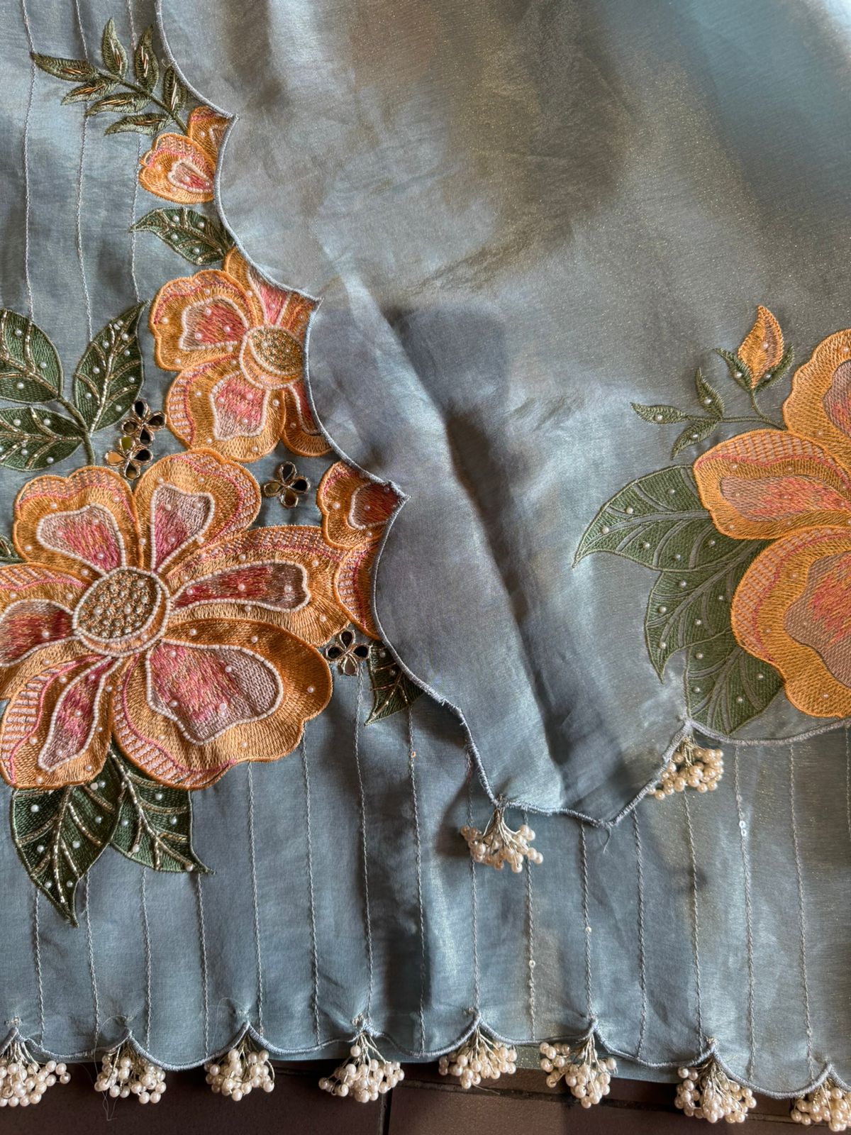 The shirt front has very beautiful floral embroidered boota with pearl work detailings