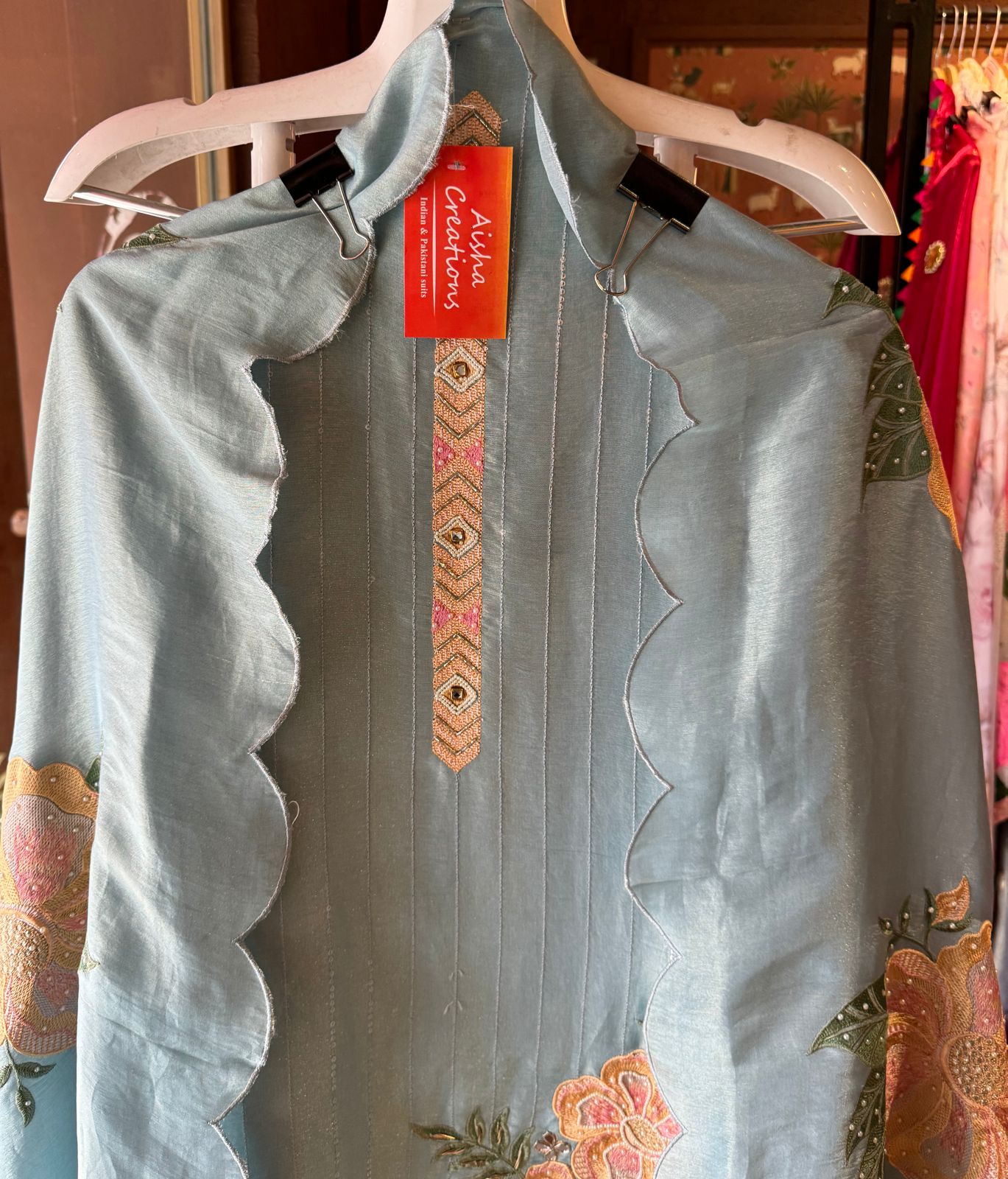 The shirt front has very beautiful floral embroidered boota with pearl work detailings