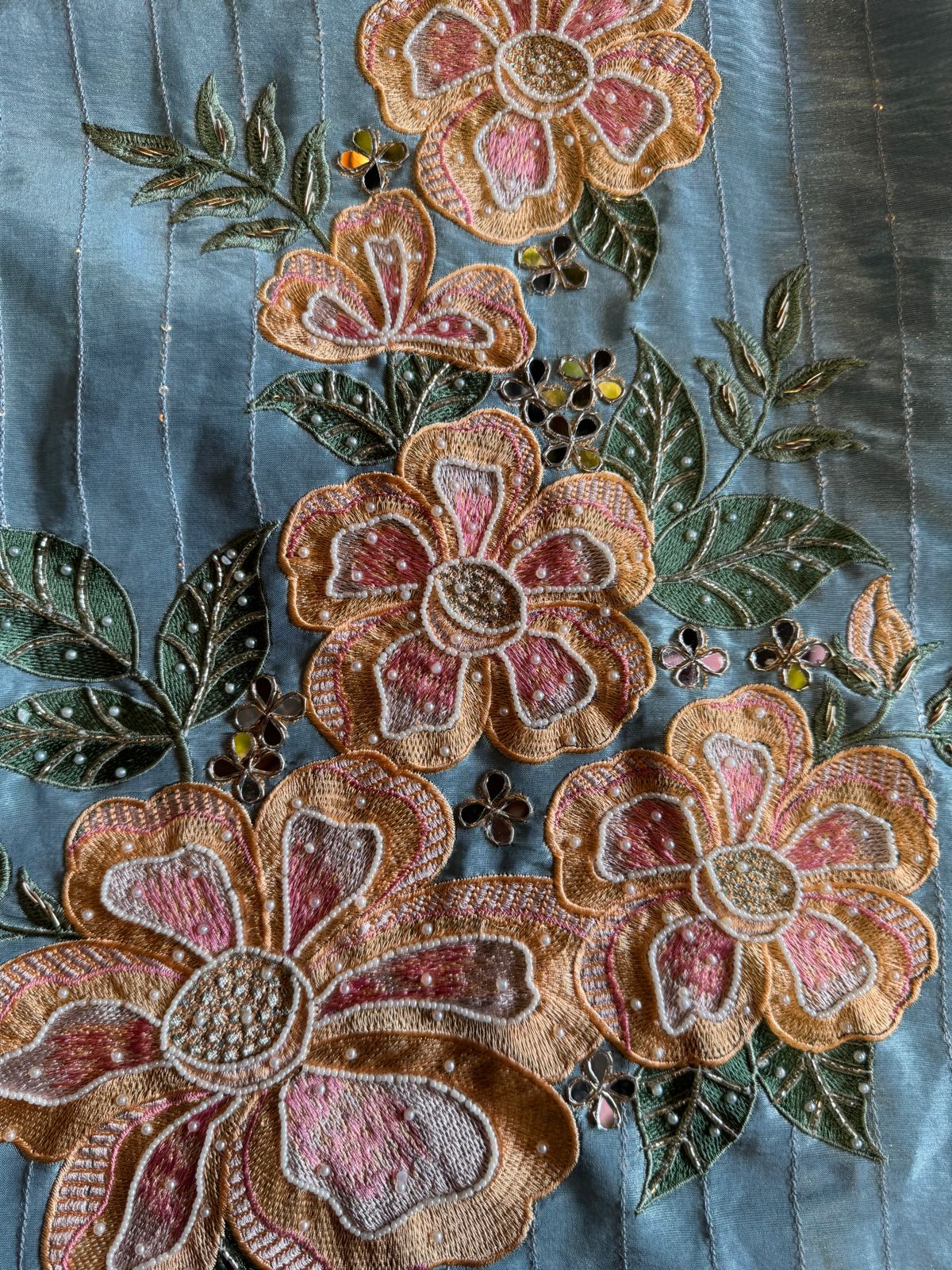 The shirt front has very beautiful floral embroidered boota with pearl work detailings