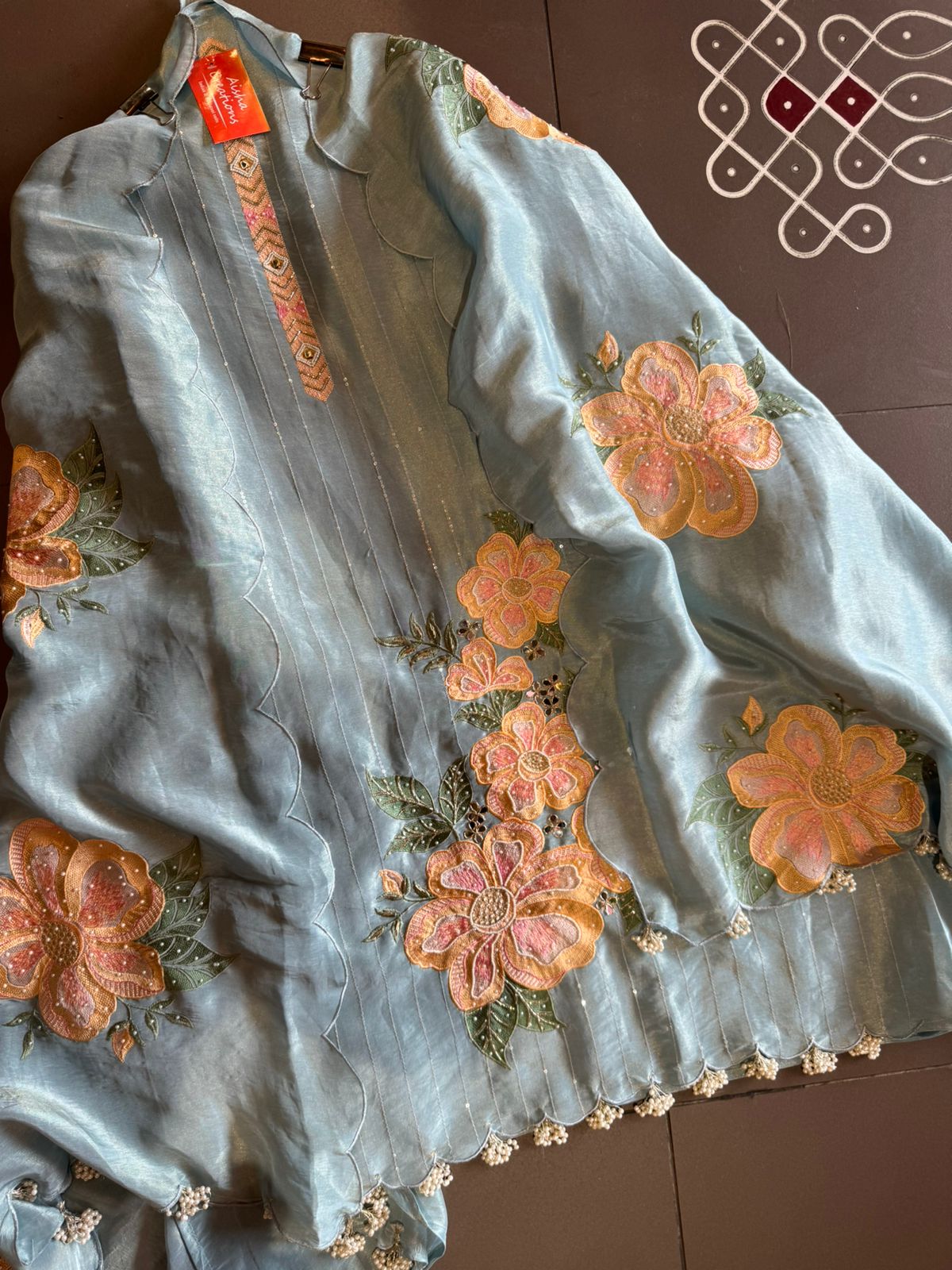 The shirt front has very beautiful floral embroidered boota with pearl work detailings