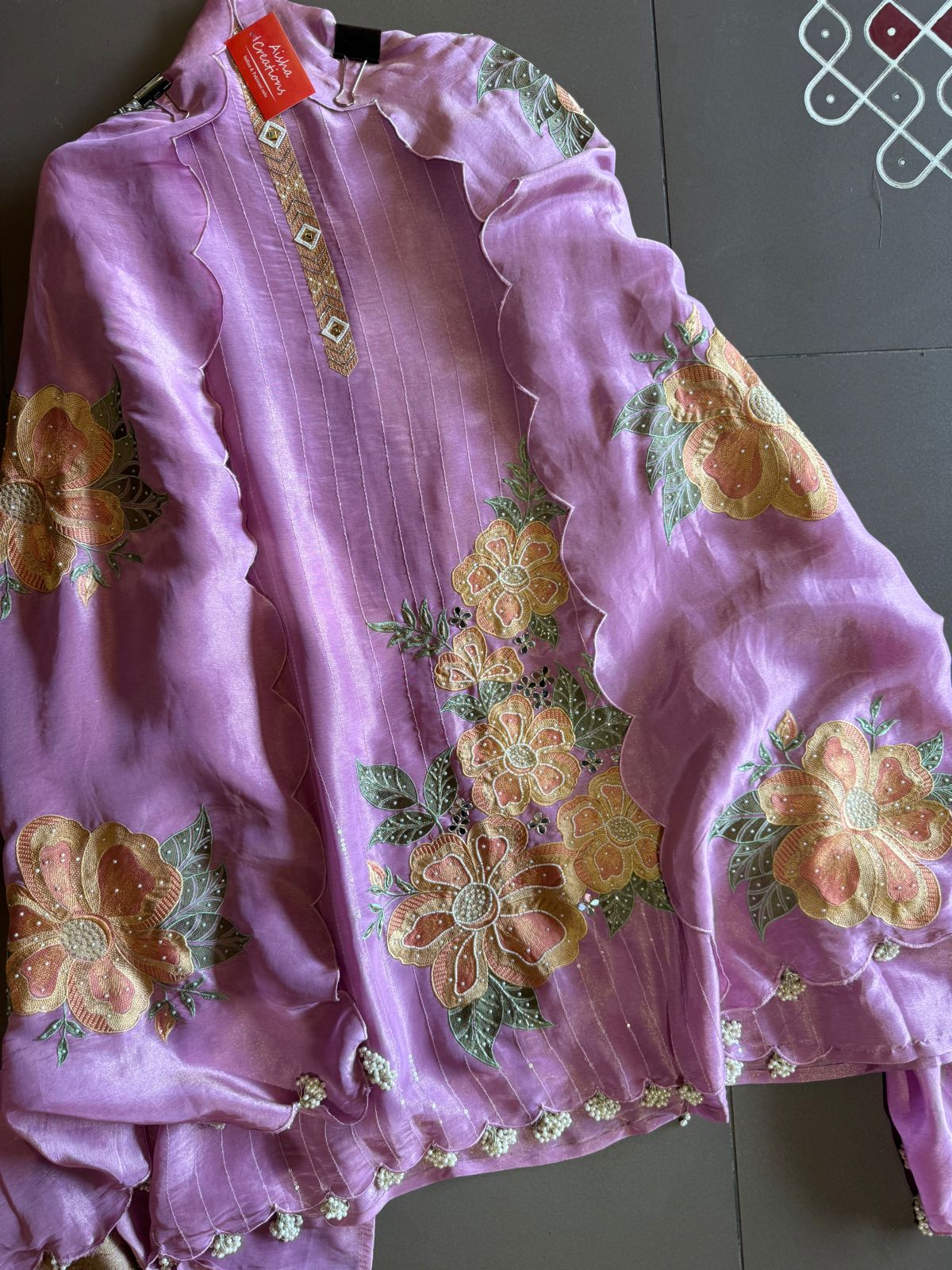 The shirt front has very beautiful floral embroidered boota with pearl work detailings