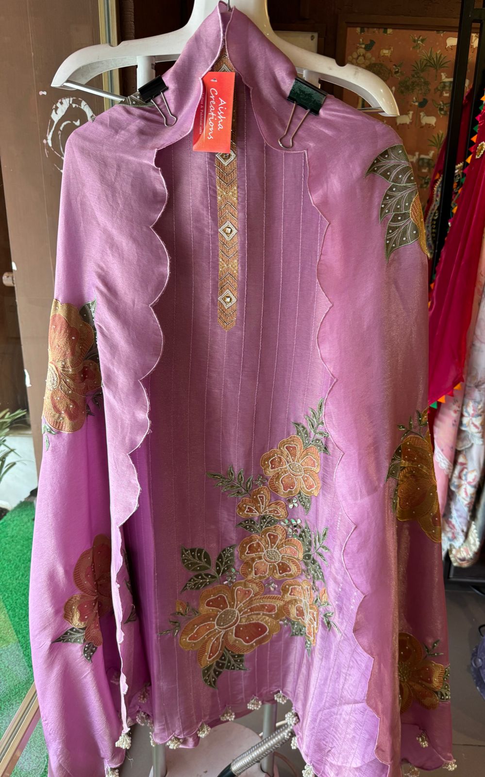 The shirt front has very beautiful floral embroidered boota with pearl work detailings