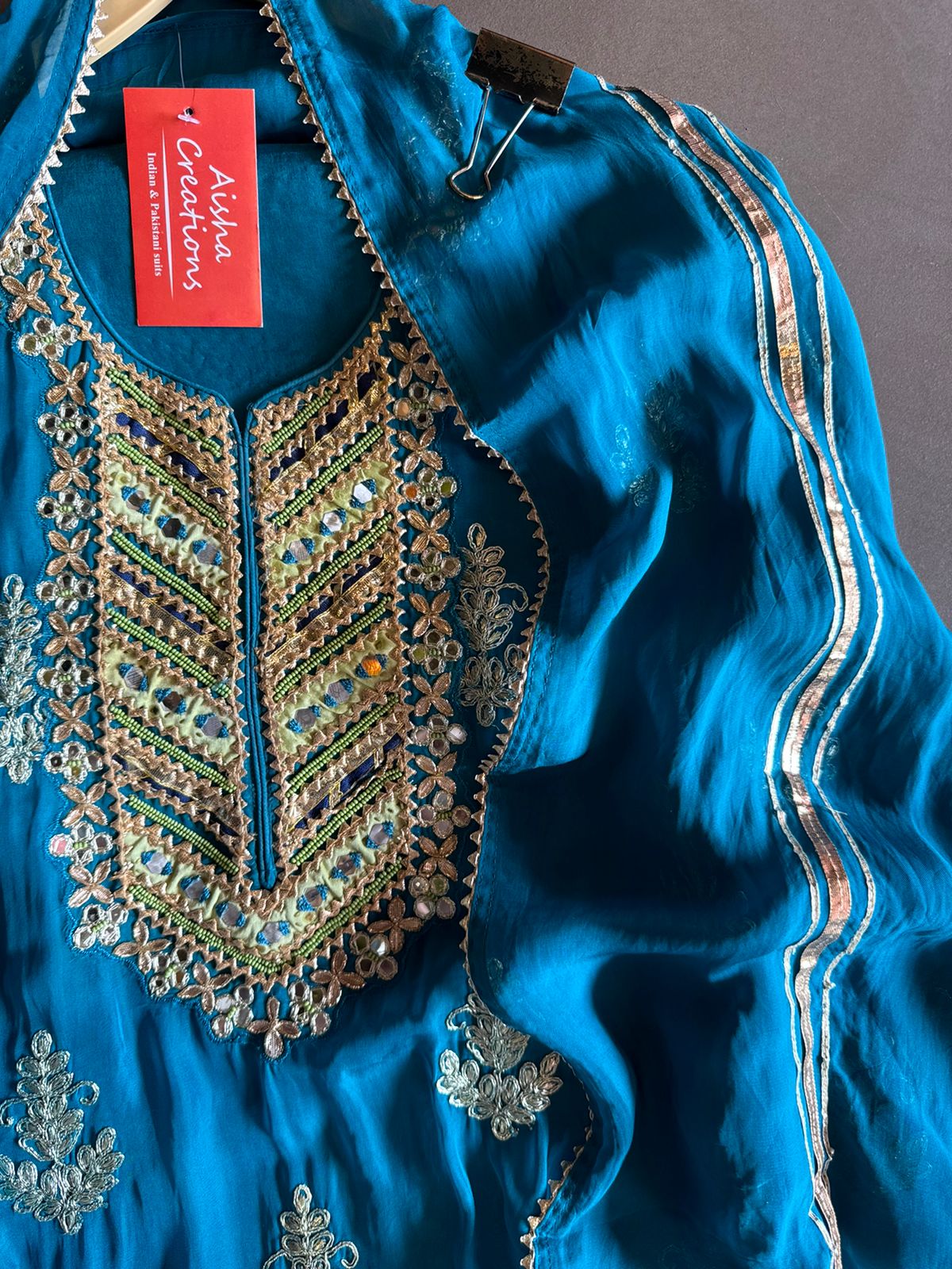 Soft organza Unstitched shirt with heavily embroidered zari bootas with leather gotta work