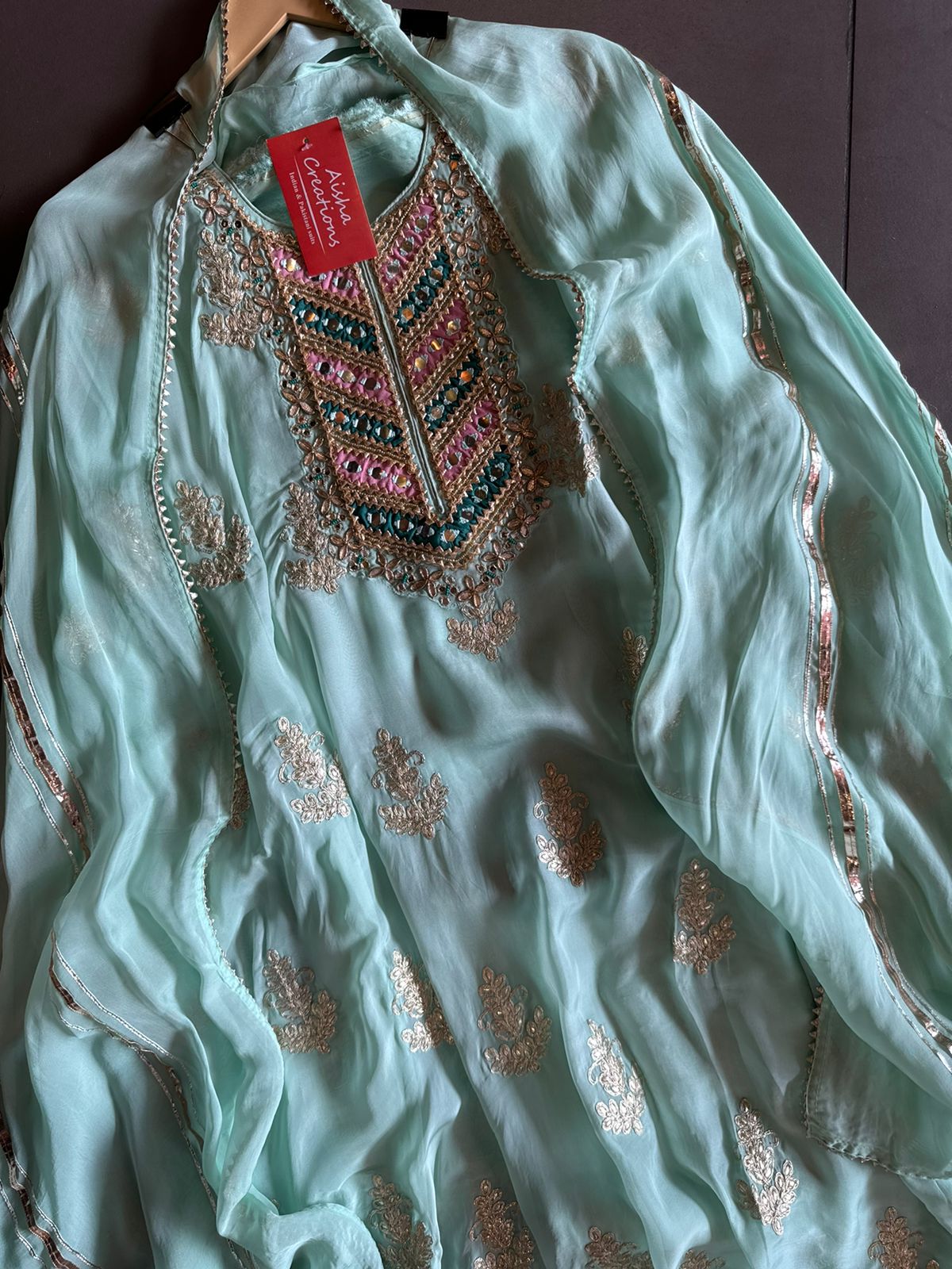 Soft organza Unstitched shirt with heavily embroidered zari bootas with leather gotta work