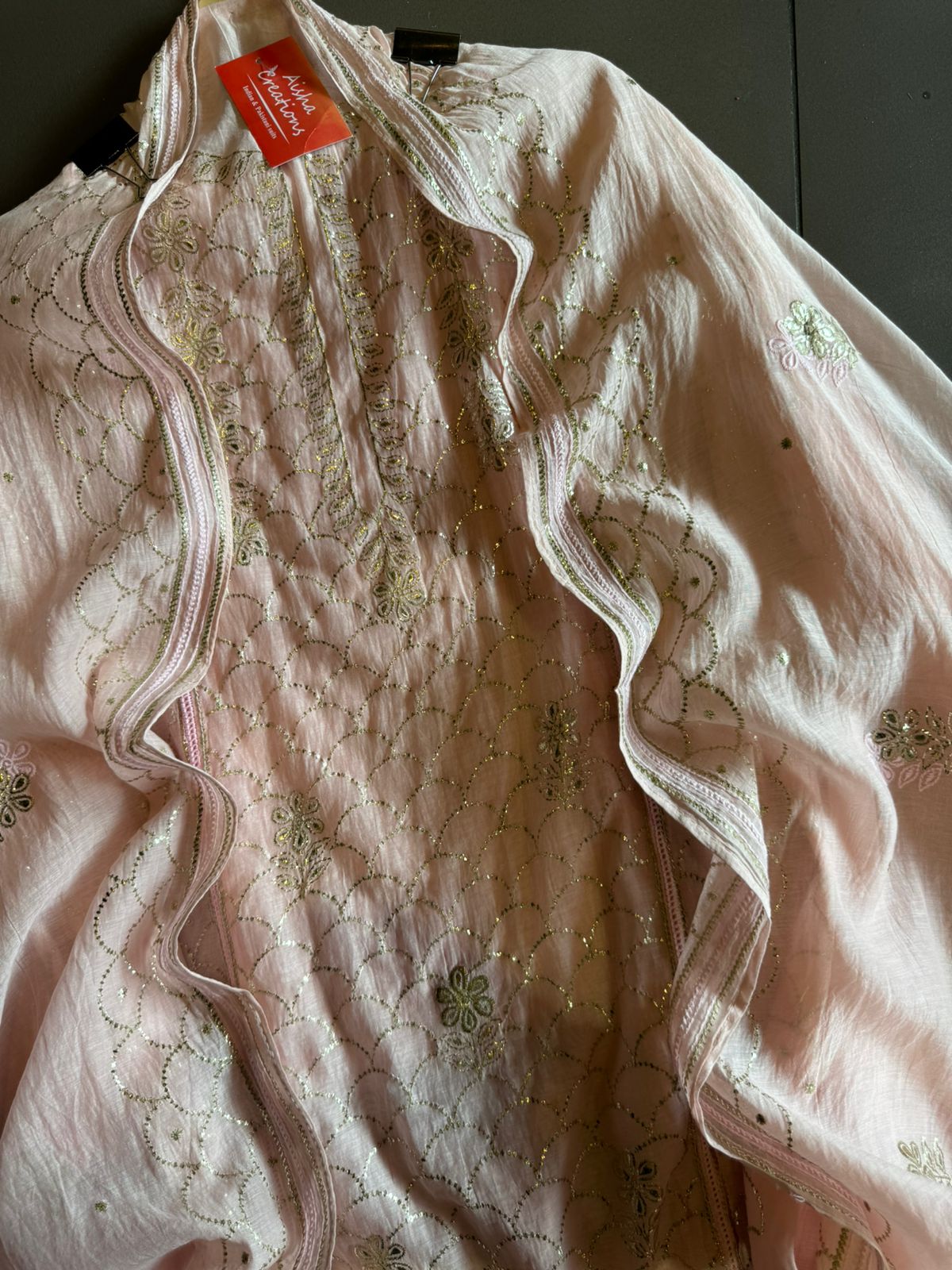 Unstitched Mul suit pieces with original pitta work done on the full shirt front giving it a very Beautiful & rich look