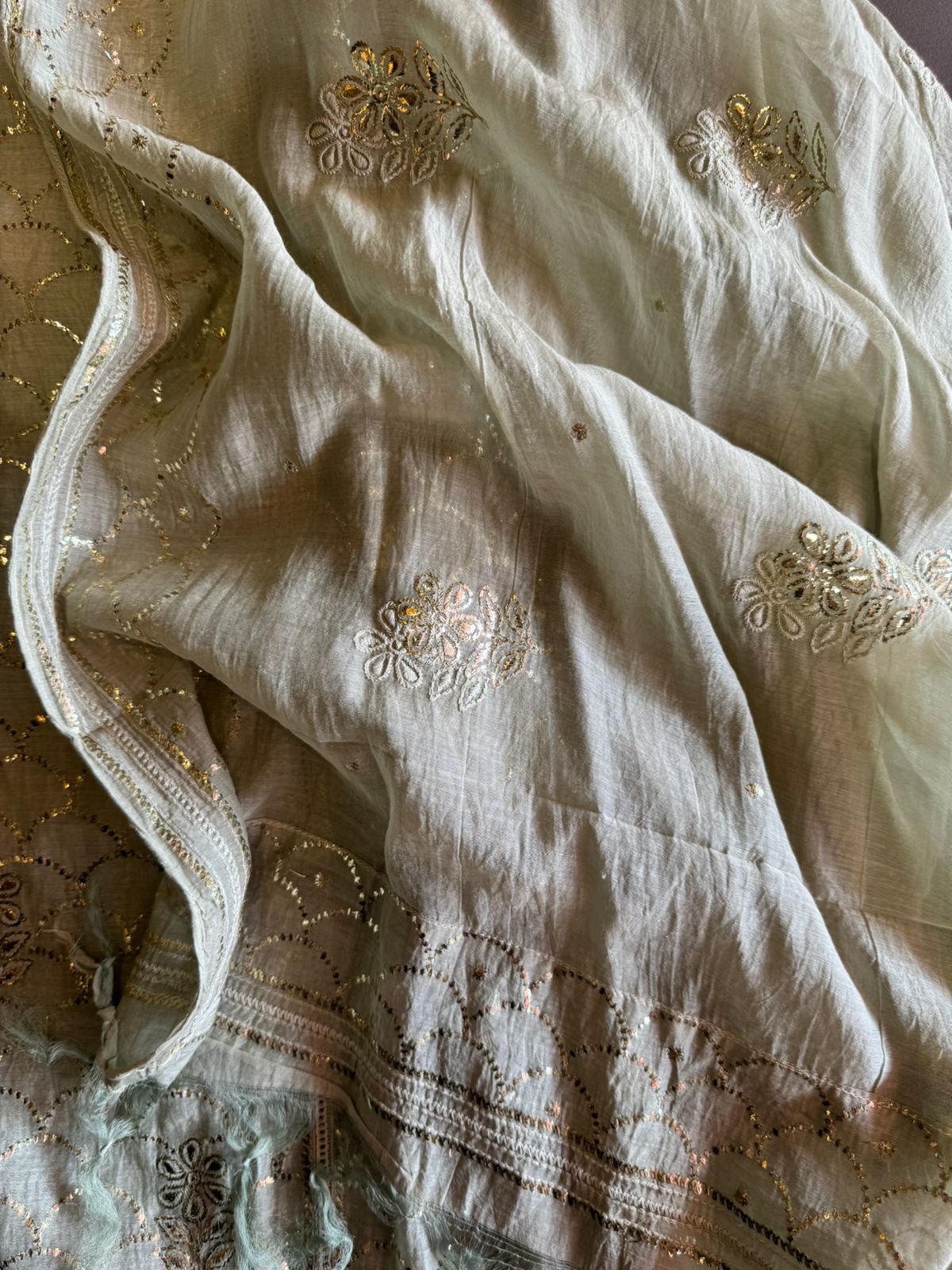 Unstitched Mul suit pieces with original pitta work done on the full shirt front giving it a very Beautiful & rich look