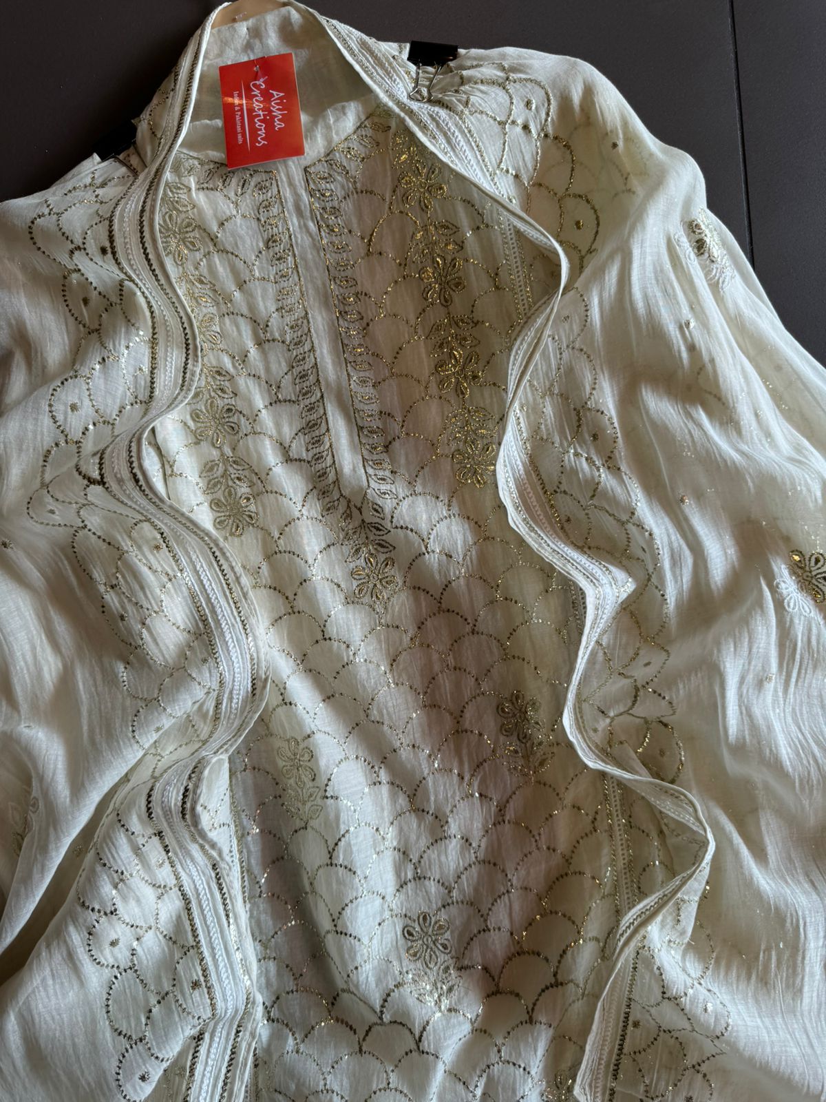 Unstitched Mul suit pieces with original pitta work done on the full shirt front giving it a very Beautiful & rich look