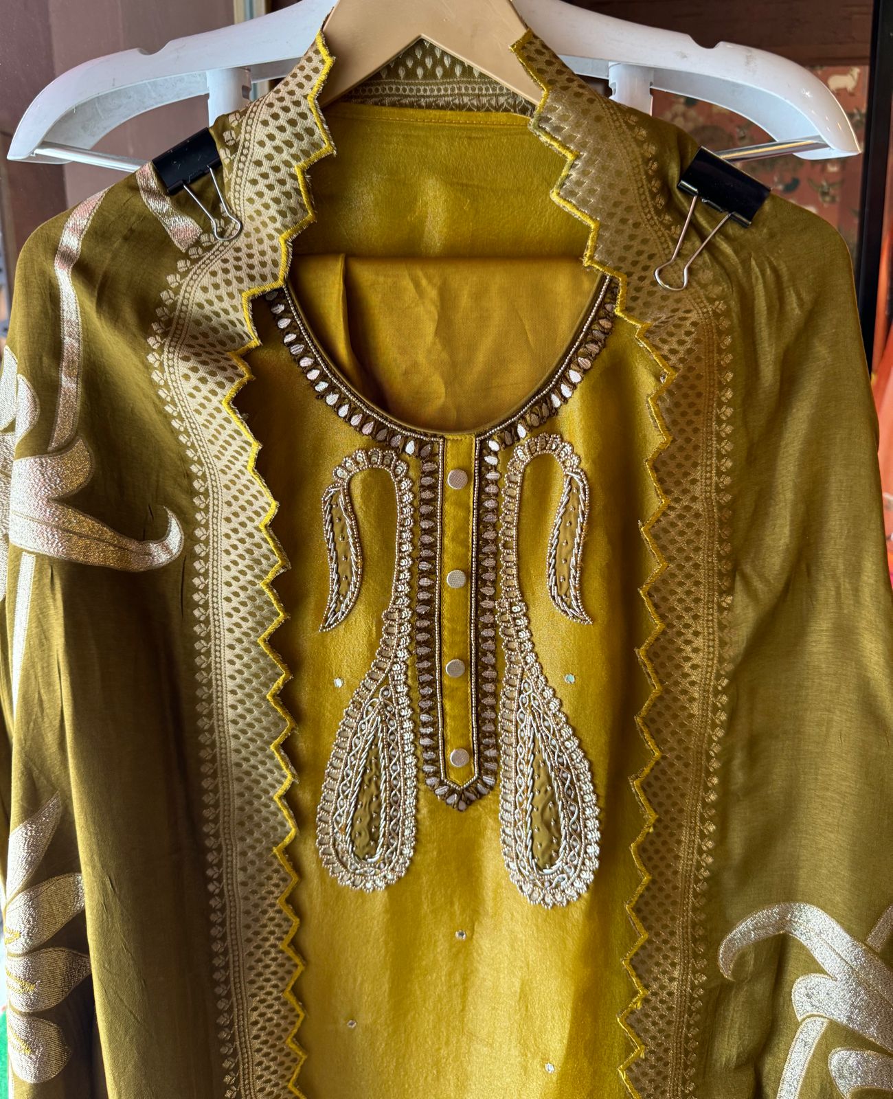 Pure Shimmer tissue Unstitched Shirt with Moti work on the neckline with thread and gotta patti detailings as well.