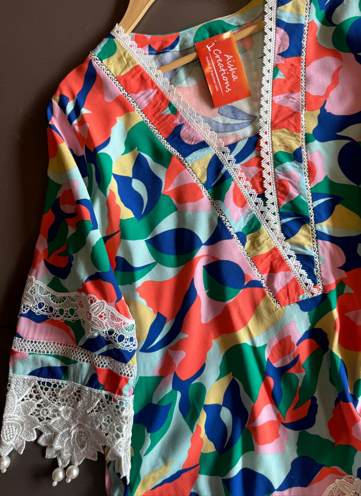 Multi coloured Satya Paul inspired print on Cotton fabric with crochia lace detailings concept with pearl latkans attached on the ghera and sleeves as well