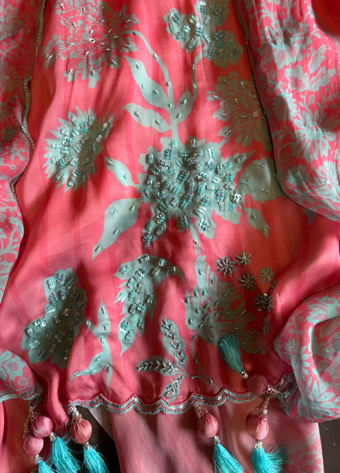 Premium Quality soft organza digital printed suits with handwork detailings on the shirt from and even on the neck Patti.