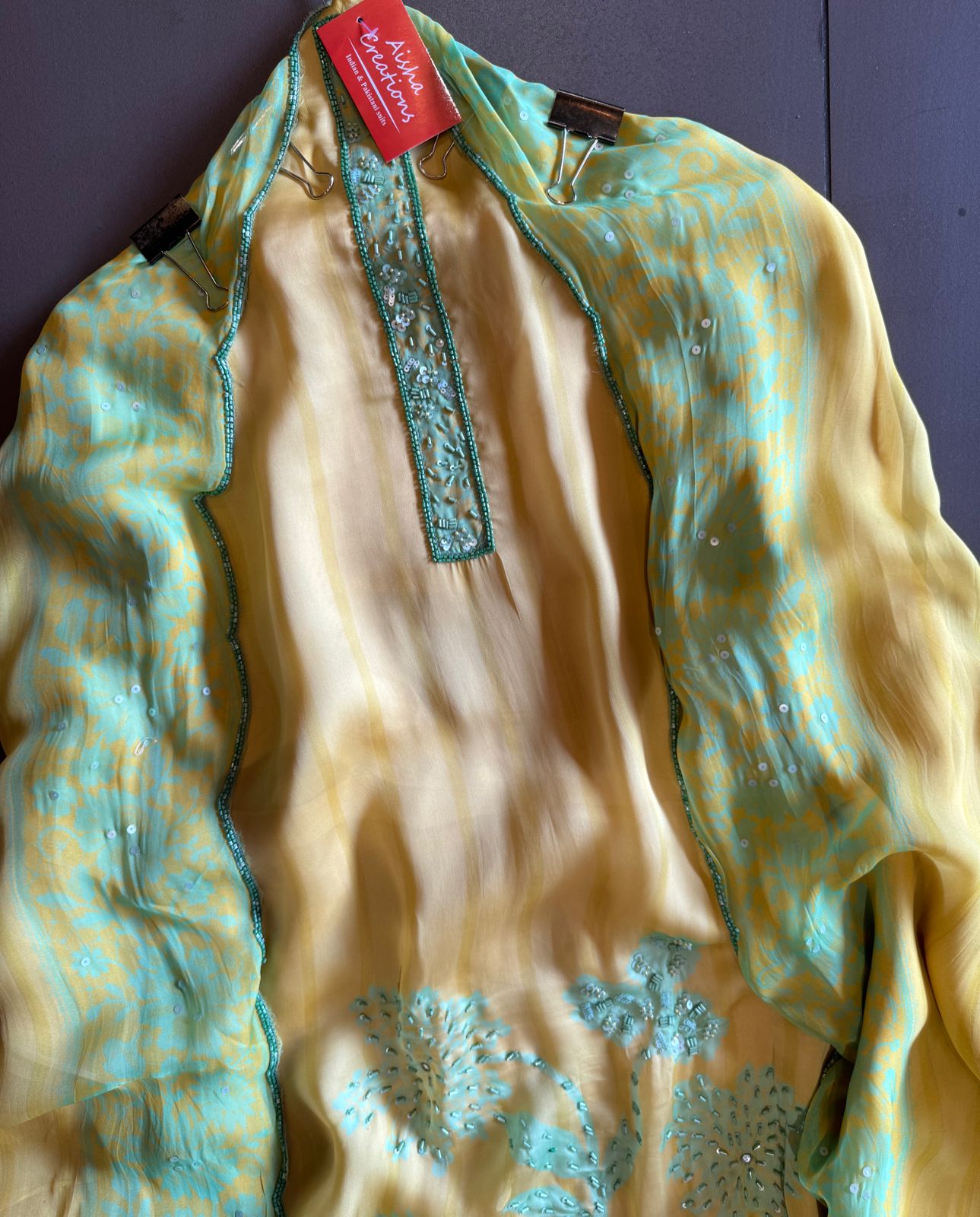 Premium Quality soft organza digital printed suits with handwork detailings on the shirt from and even on the neck Patti.