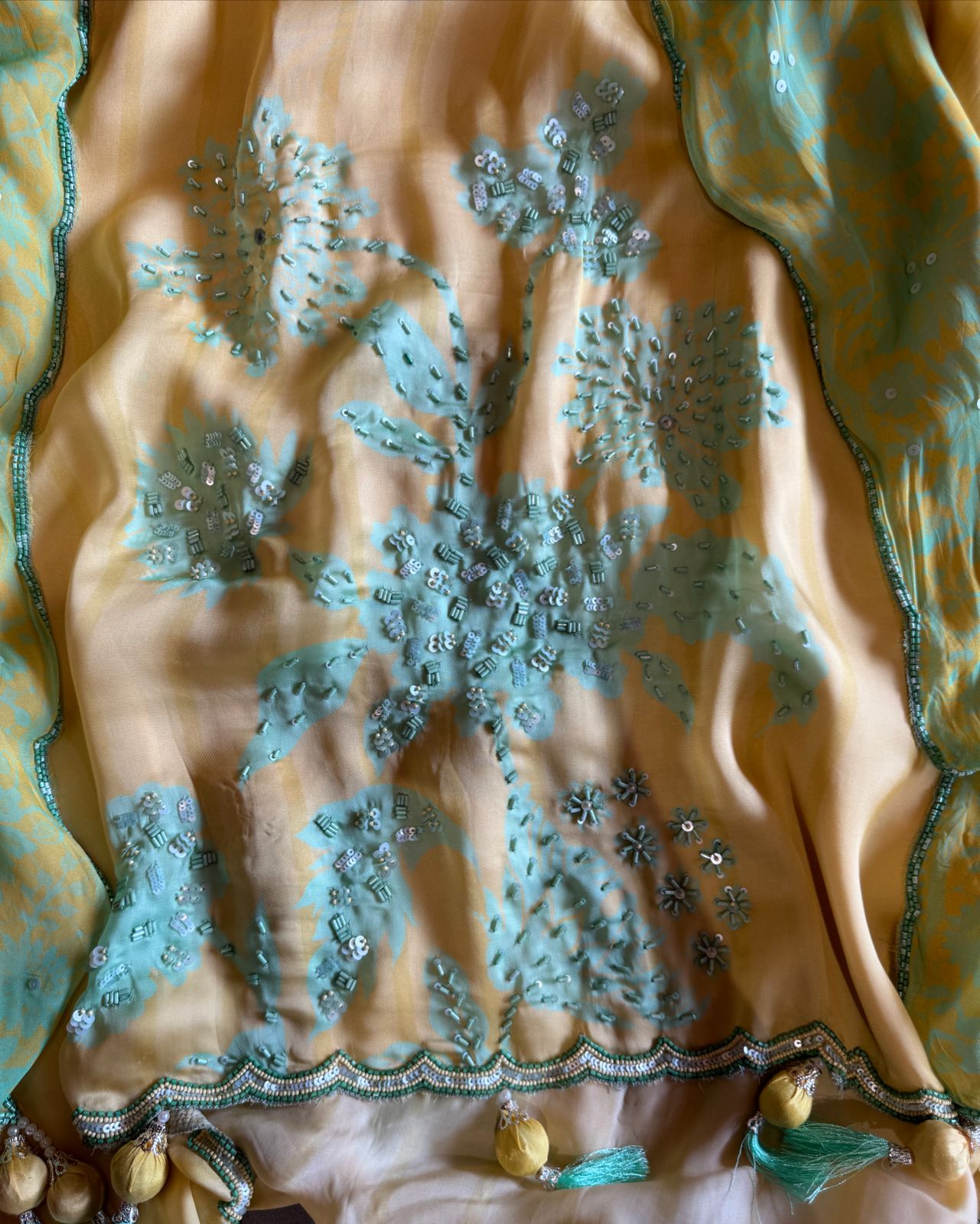 Premium Quality soft organza digital printed suits with handwork detailings on the shirt from and even on the neck Patti.