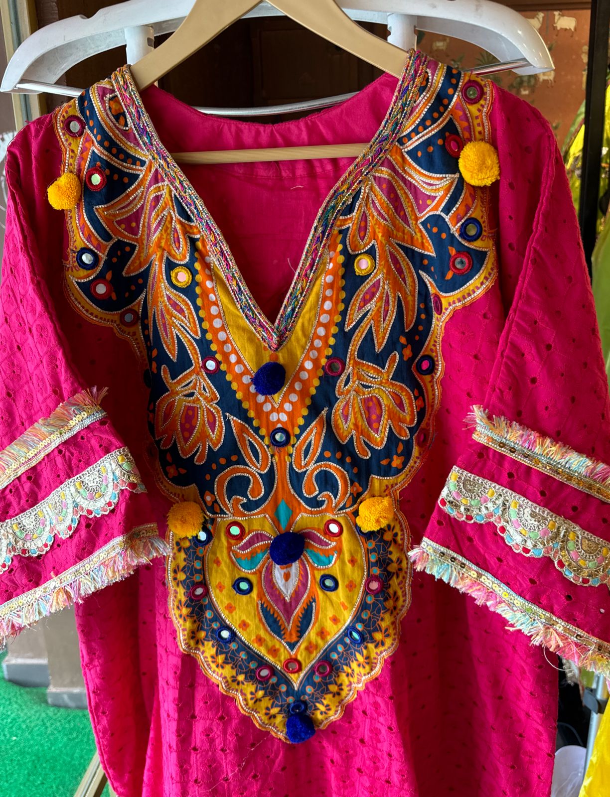 Beautiful Hakuba chicken tunic Looser fit with Gorgeous Mughal paisley print patch on the neckline with Pom Pom’s attached
