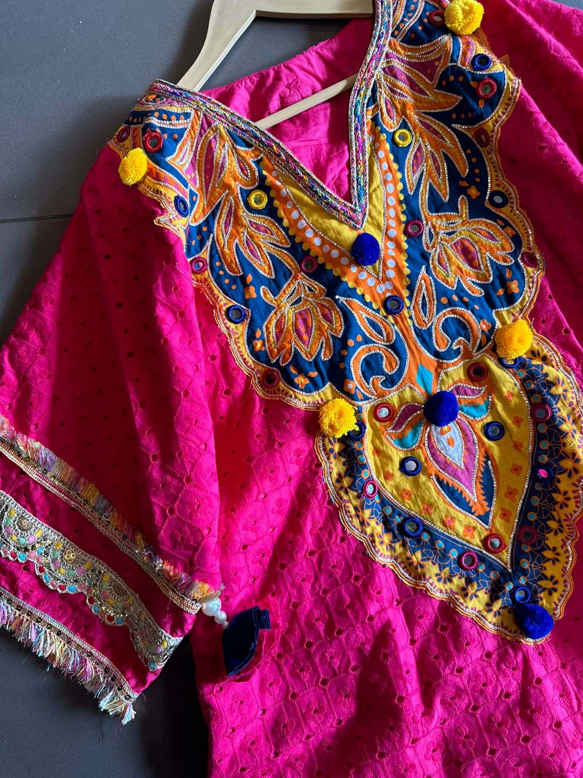 Beautiful Hakuba chicken tunic Looser fit with Gorgeous Mughal paisley print patch on the neckline with Pom Pom’s attached