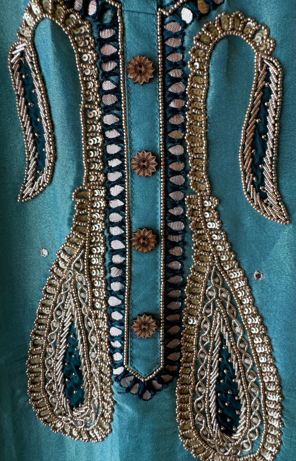 Pure Shimmer tissue Unstitched Shirt with Moti work on the neckline with thread and gotta patti detailings as well.