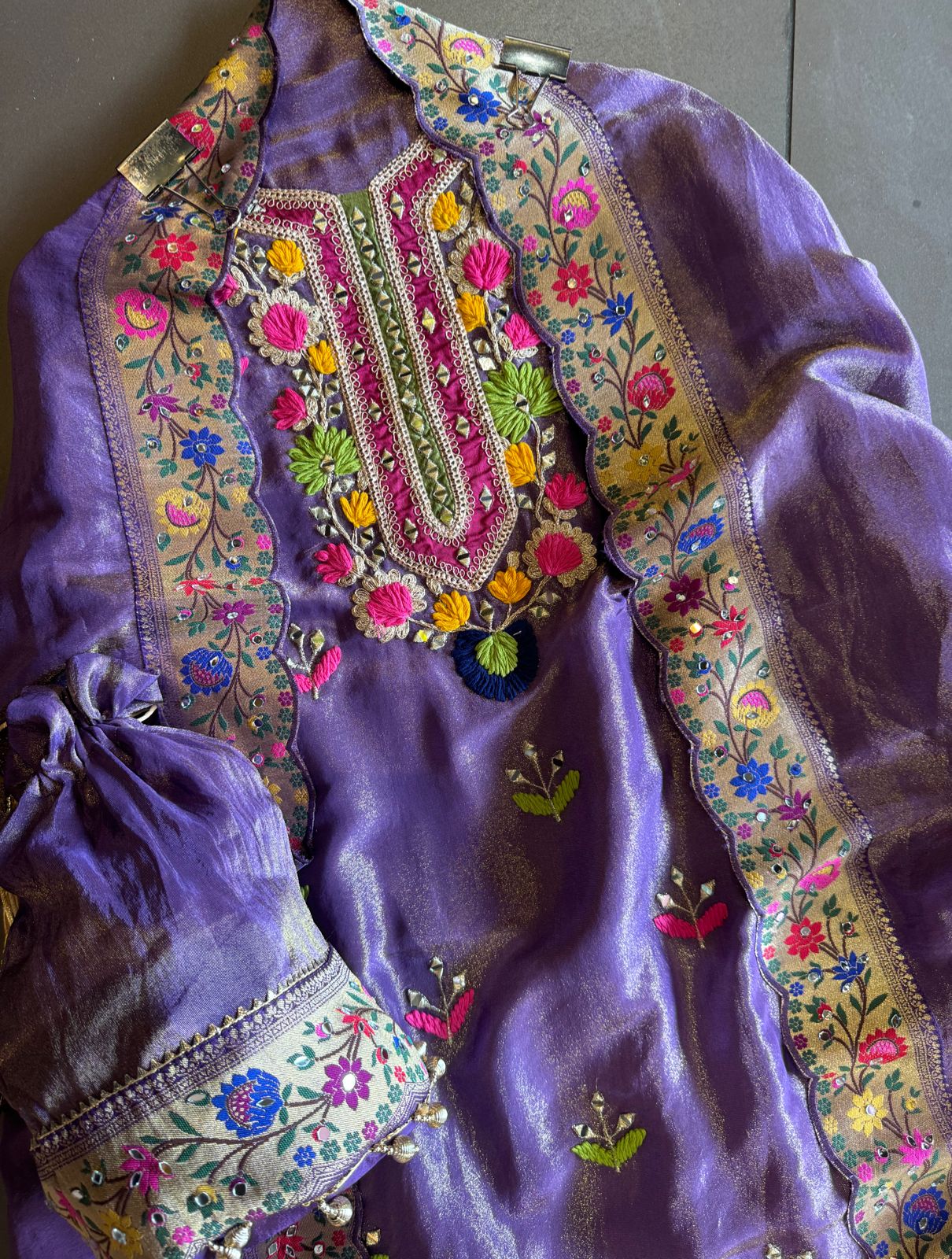 Beautiful shimmer tissue Unstitched Full size shirt with multi Coloured thread embroidery done with the neckline and ghera with Moti lace attached on the ghera.