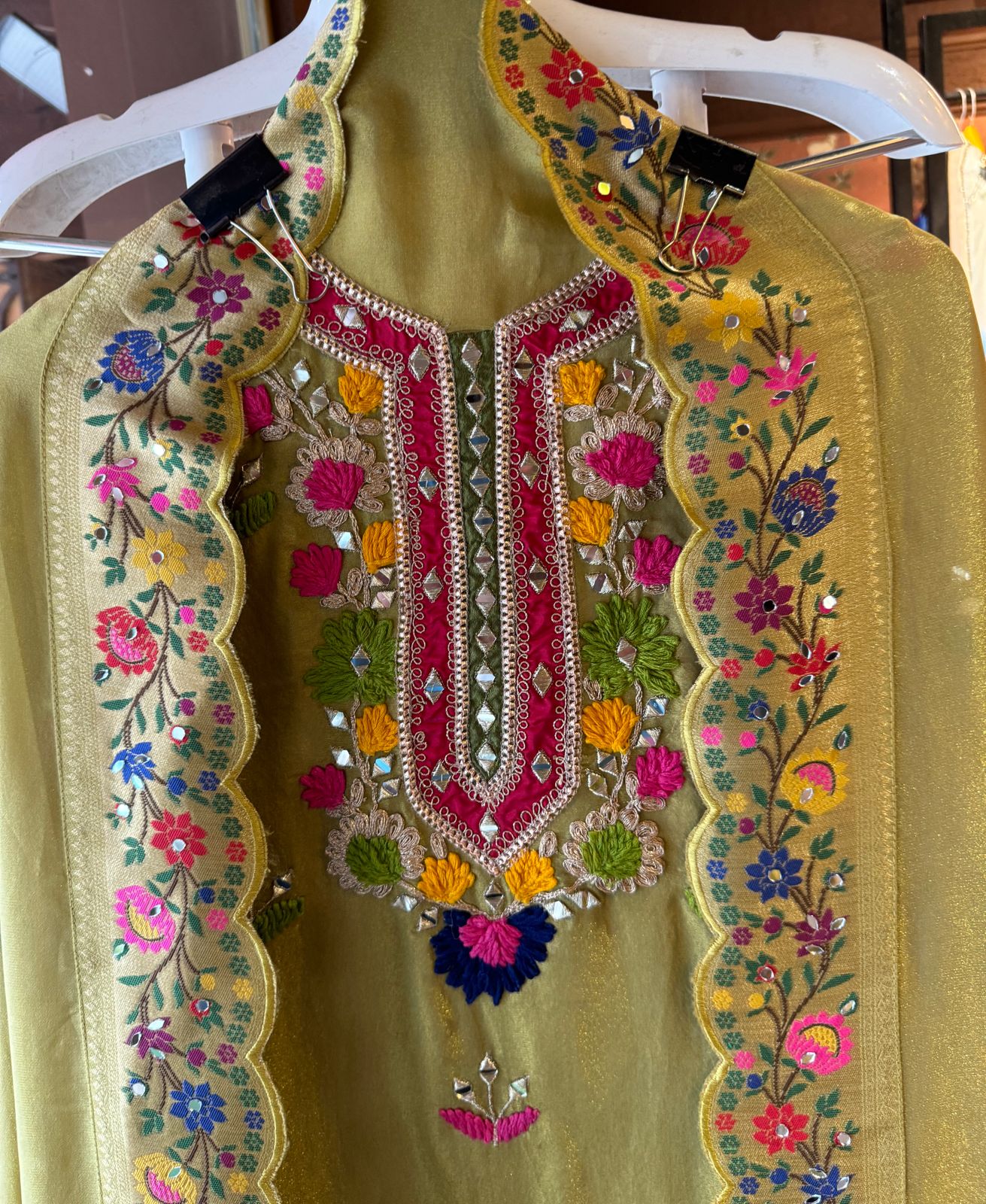 Beautiful shimmer tissue Unstitched Full size shirt with multi Coloured thread embroidery done with the neckline and ghera with Moti lace attached on the ghera.