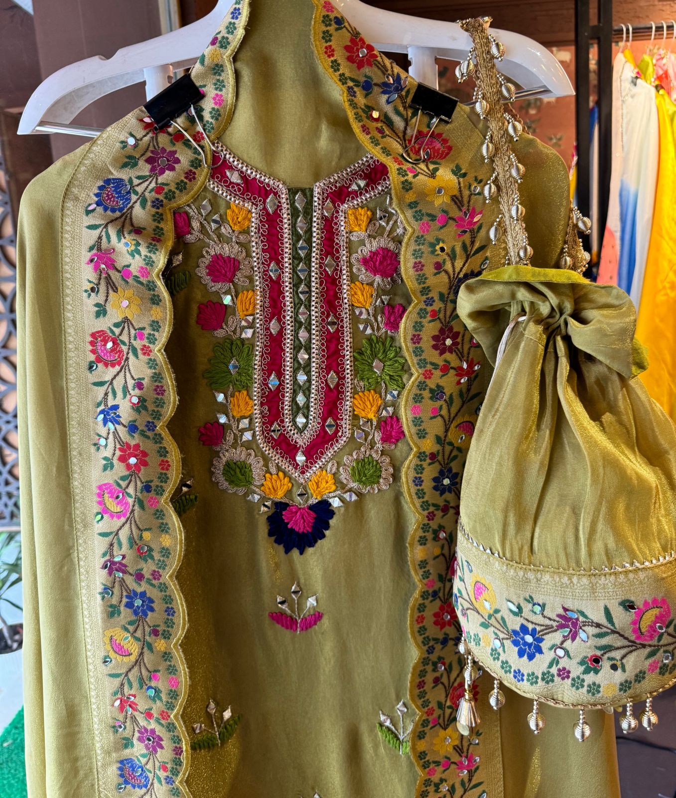 Beautiful shimmer tissue Unstitched Full size shirt with multi Coloured thread embroidery done with the neckline and ghera with Moti lace attached on the ghera.