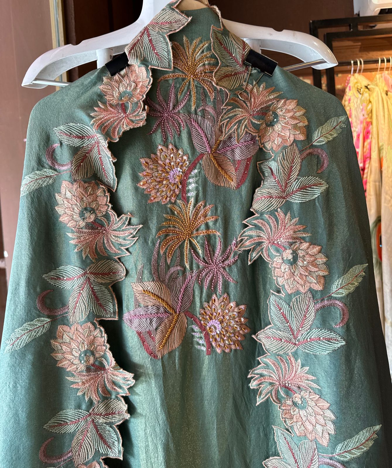 Shimmer tissue unstitched full size shirt with very smart Neckwork done with thread and Moti work done on the neckline (Very beautifully done)