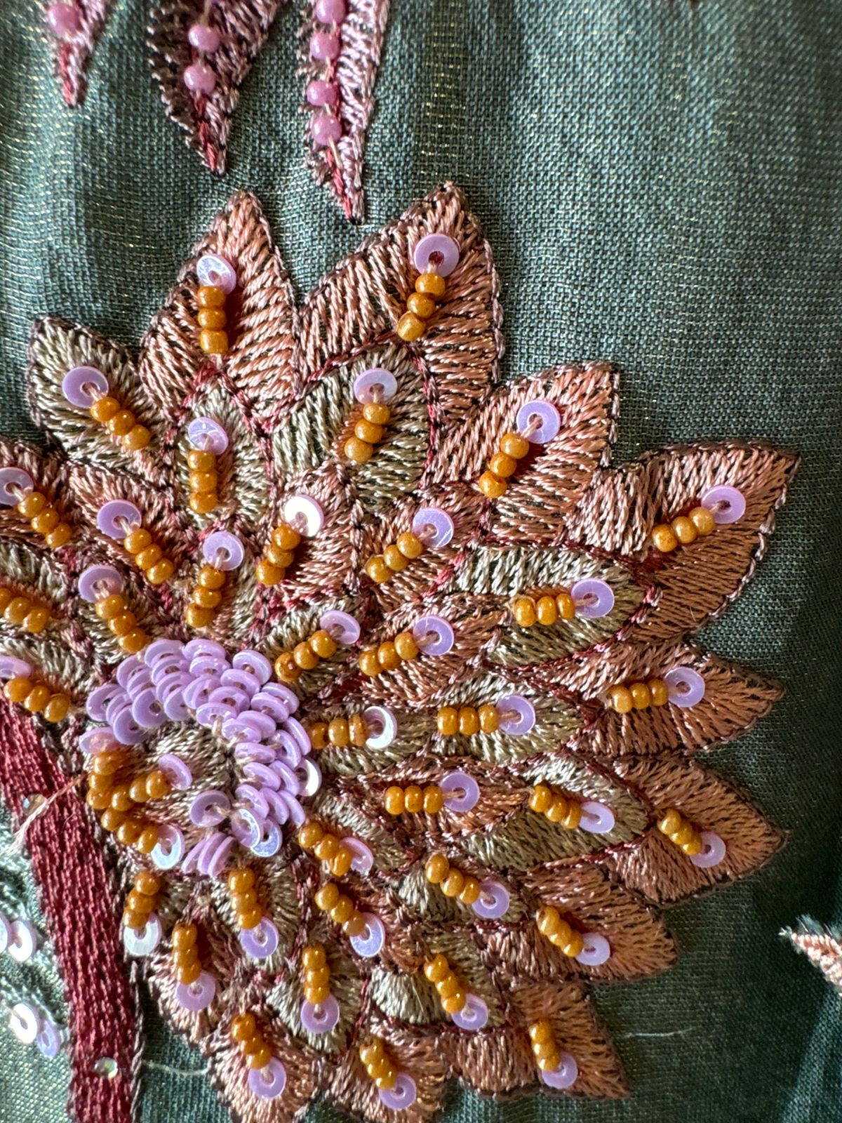 Shimmer tissue unstitched full size shirt with very smart Neckwork done with thread and Moti work done on the neckline (Very beautifully done)