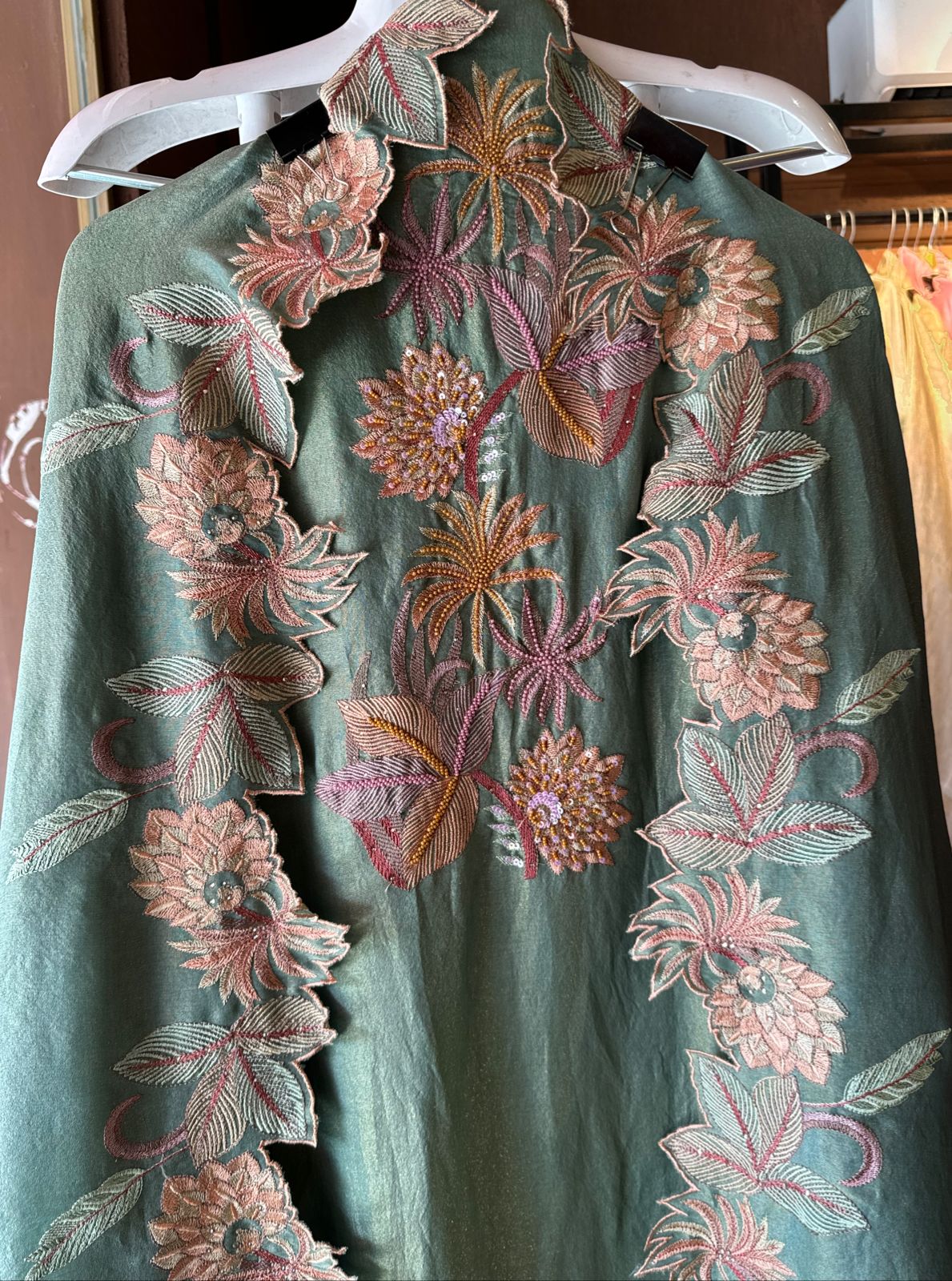 Shimmer tissue unstitched full size shirt with very smart Neckwork done with thread and Moti work done on the neckline (Very beautifully done)