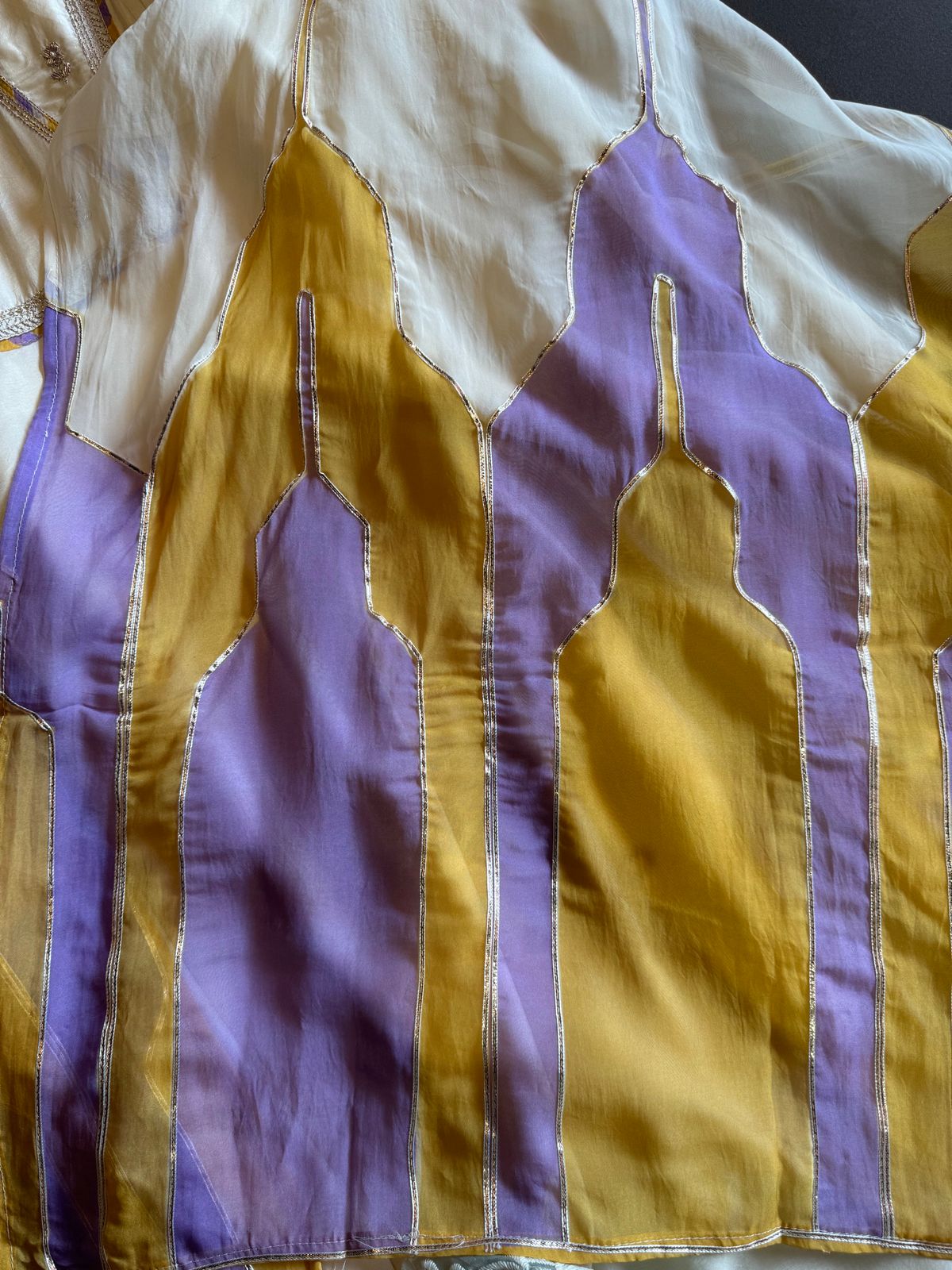 Soft organza Unstitched Shirt with angrakha design neckline with Dori and Dabka work booties with piping done.