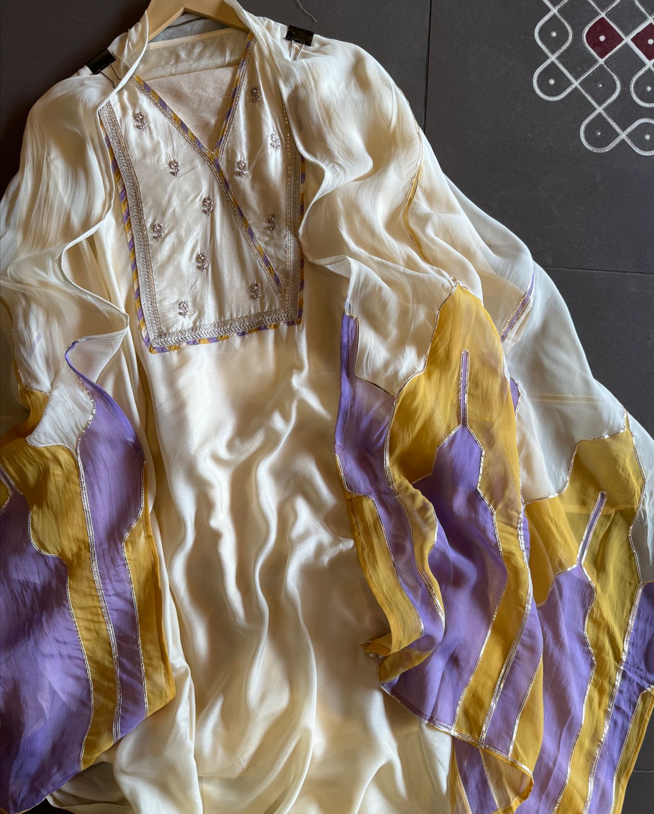 Soft organza Unstitched Shirt with angrakha design neckline with Dori and Dabka work booties with piping done.