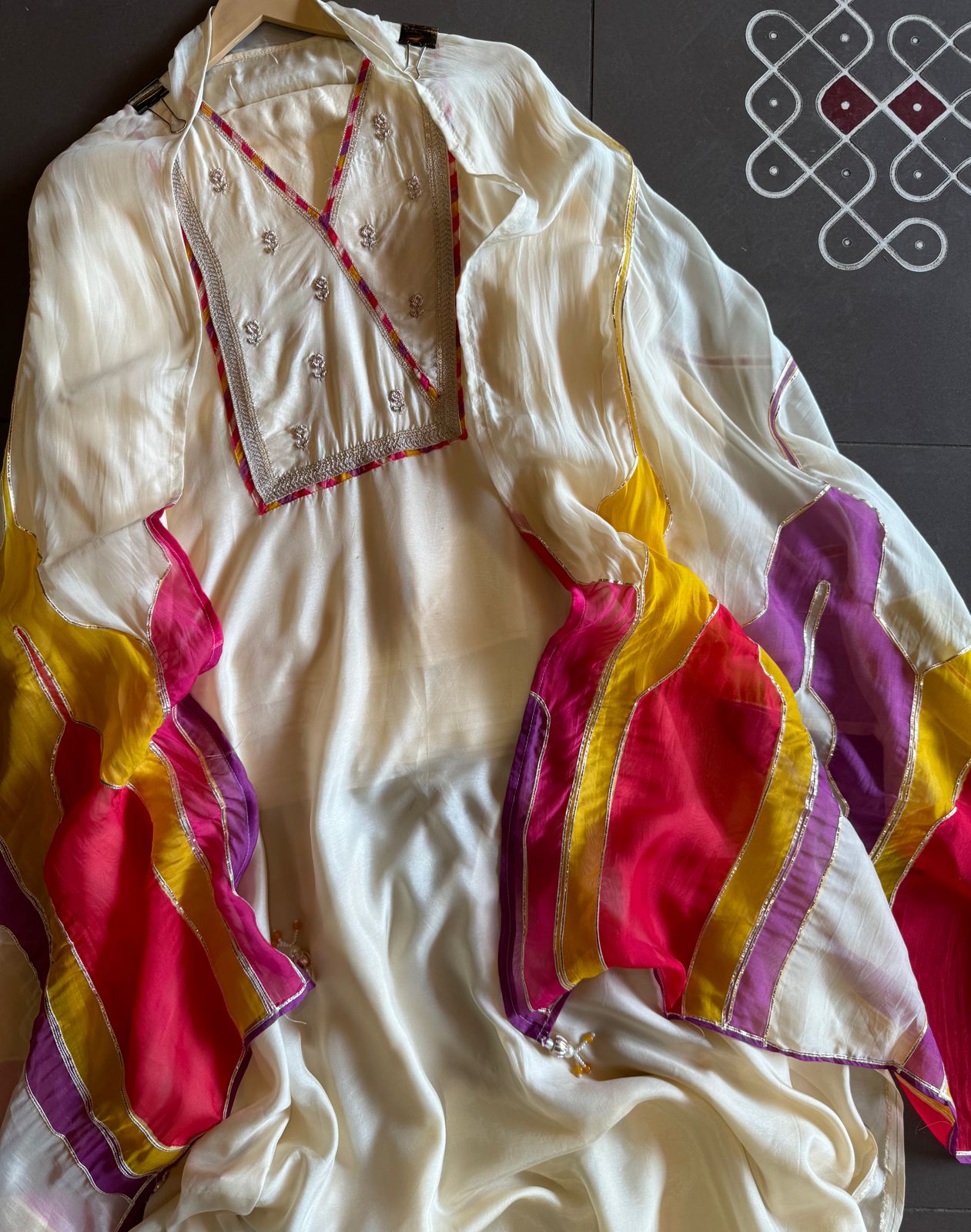 Soft organza Unstitched Shirt with angrakha design neckline with Dori and Dabka work booties with piping done.