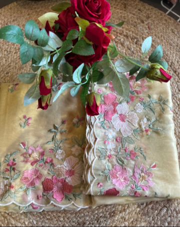 Organza Unstitched suit fabrics with very gorgeous floral threadwork on the ghera with soft Cutwork and scalloping