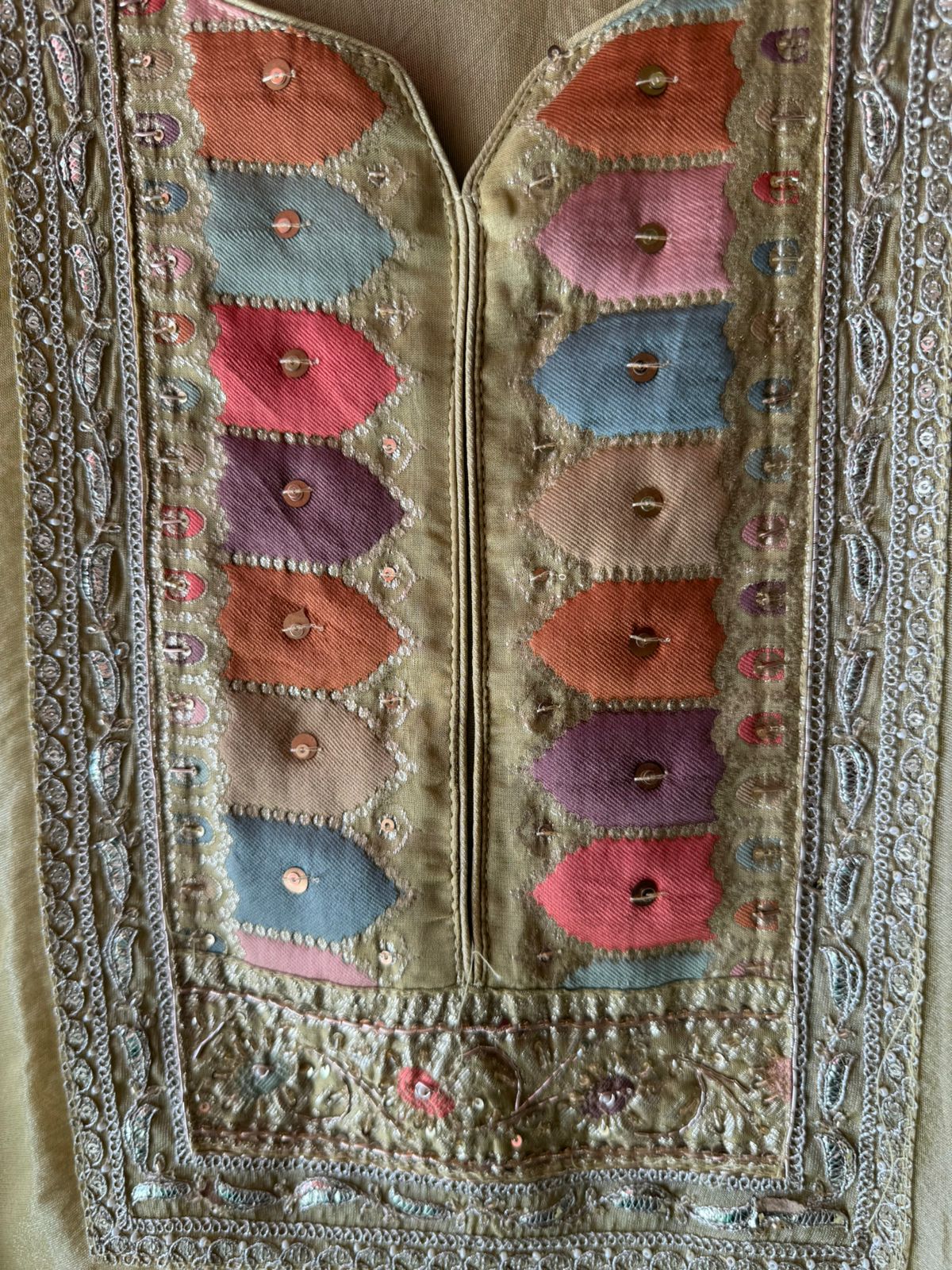 Shimmer tissue Unstitched Shirt with Sabyasachi inspired Neckline and Saaman Colourful cushioned pattern with sequence and Dori work detailings.