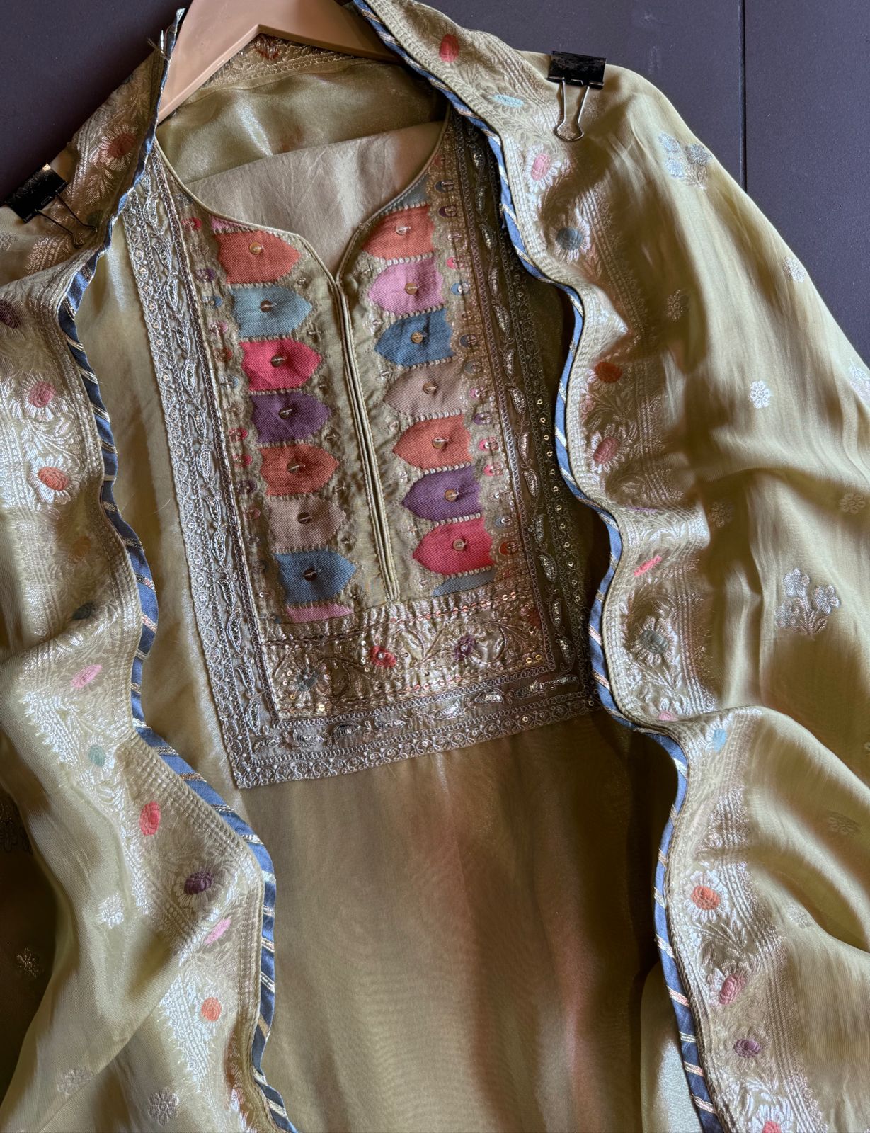 Shimmer tissue Unstitched Shirt with Sabyasachi inspired Neckline and Saaman Colourful cushioned pattern with sequence and Dori work detailings.