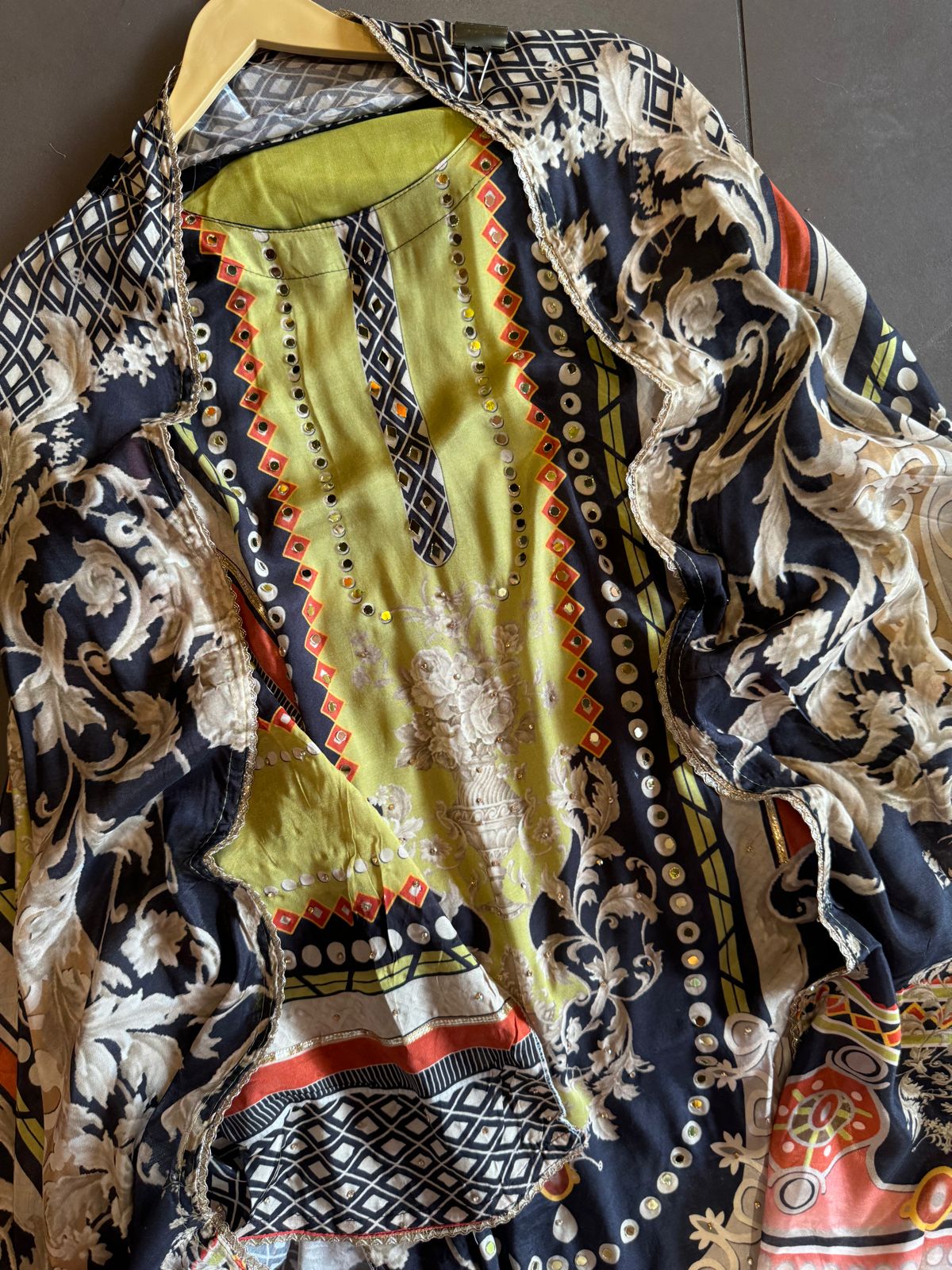 Muslin Silk digital printed Pakistani semi stitched Suit with original mirror work highlighting on the shirt front