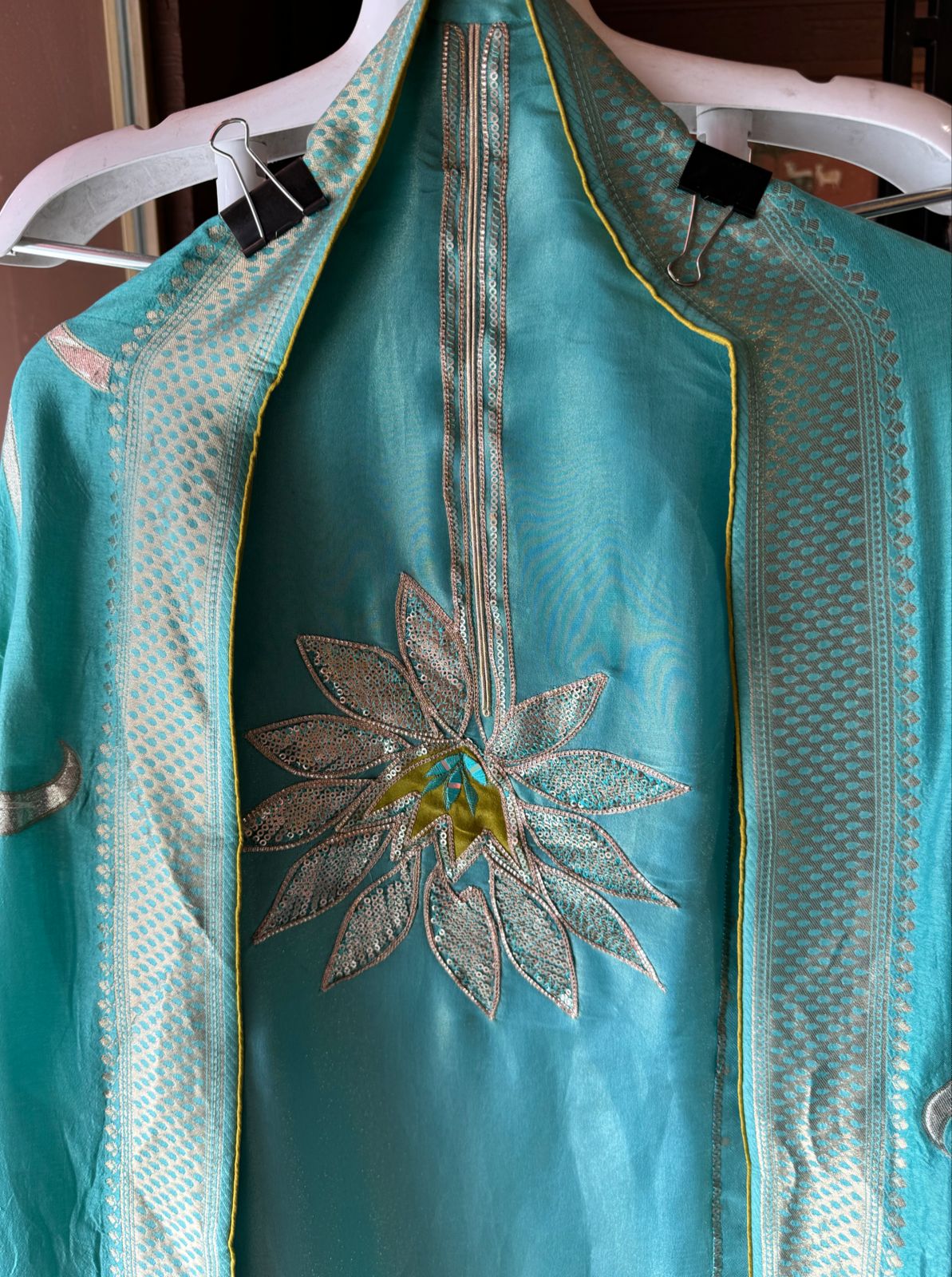 Pure Shimmer Tissue Unstitched Shirt with designer neckline with gotta Detailimgs and A flower design on the neck front with sequence and thread work done.