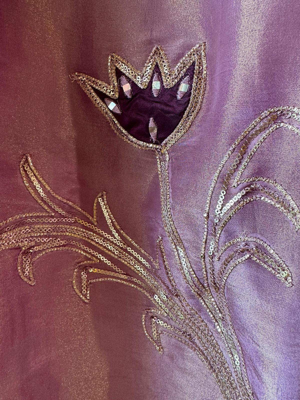 Pure Shimmer Tissue Unstitched Shirt with designer neckline with gotta Detailimgs and A flower design on the neck front with sequence and thread work done.